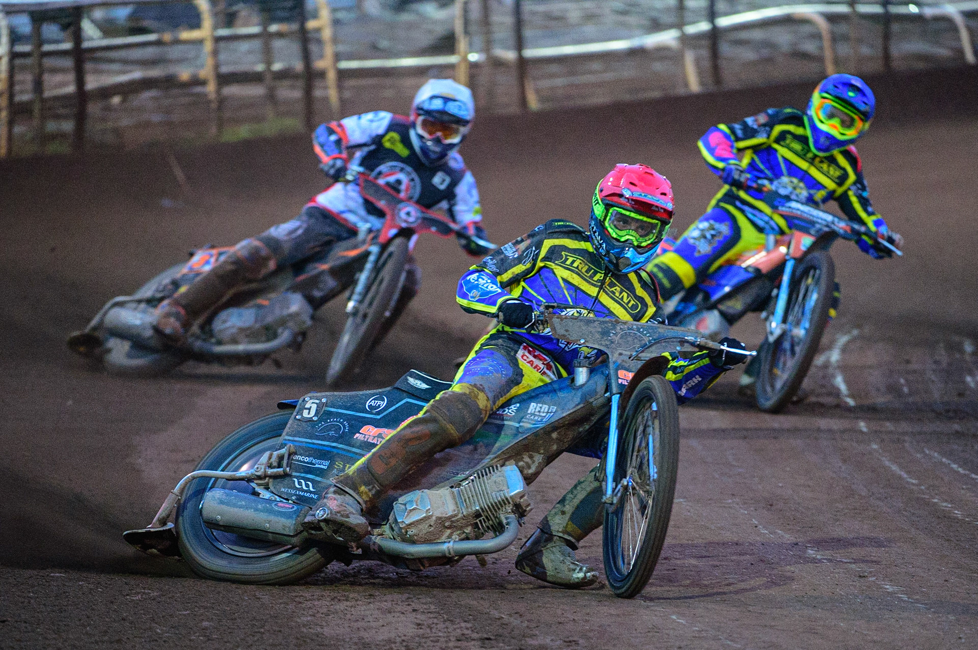 SHEFFIELD, UK. APR 14TH   Adam Ellis  (Red) leads Jake Allen   (White) and Stefan Nielsen   (Blue) during the SGB Premiership League Cup match between Sheffield Tigers and Belle Vue Aces at Owlerton Stadium, Sheffield on Thursday 14th April 2022. (Credit: Ian Charles | MI News)