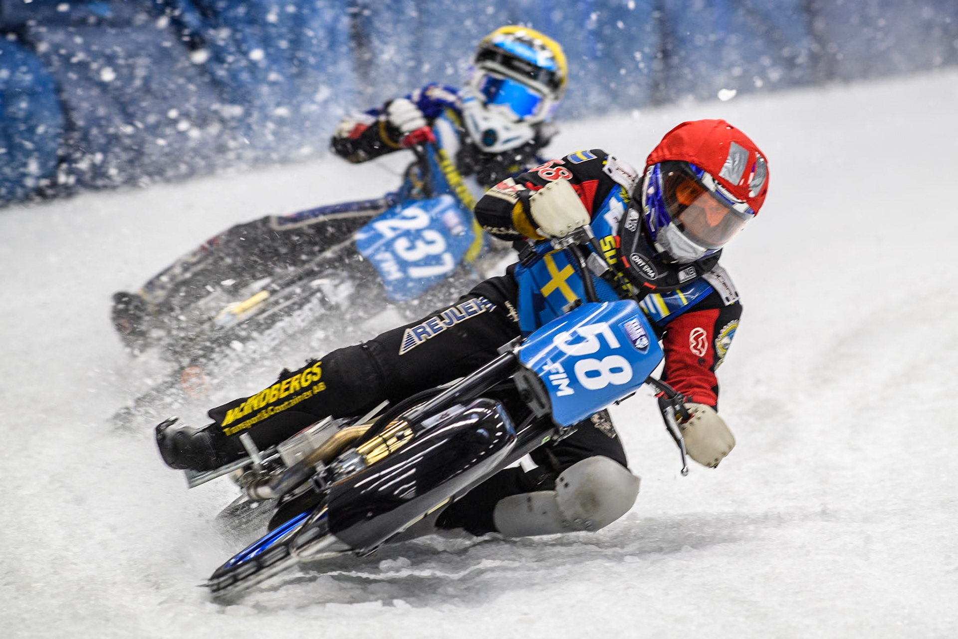 Sweden's Stefan Svensson (58) (Red) leads  Sweden's Jimmy Hörnell Lidfalk (237) (Yellow) during the FIM Ice Speedway Gladiators World Championship Final 2 at the Max-Aicher-Arena, Inzell on Sunday 24 March 2024. (Photo: Ian Charles | MI News)