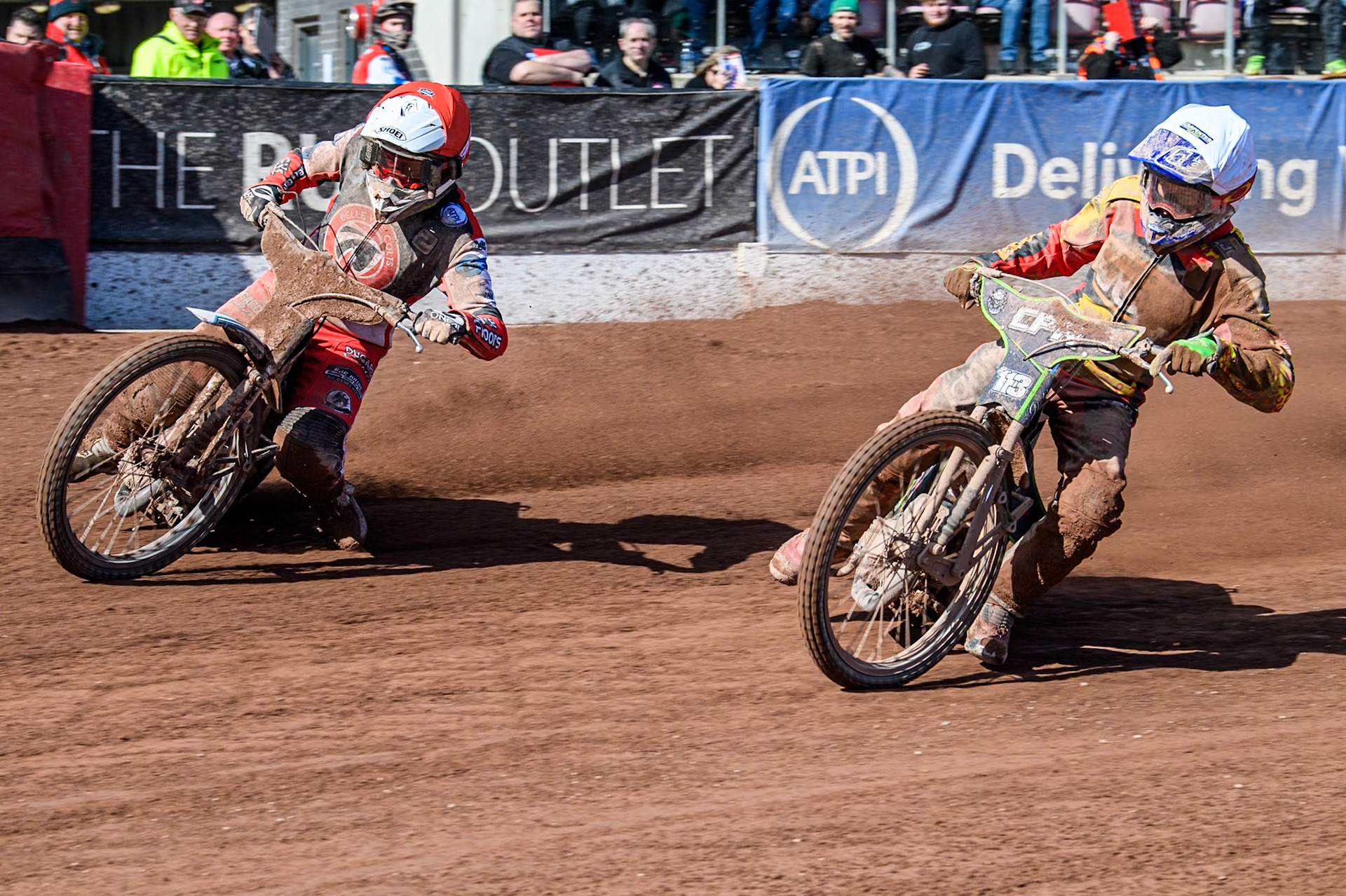 Leicester Lion Cubs' Vinnie Foord (White) inside Belle Vue Colts' Chad Wirtzfeld (Red) during the WSRA National Development League match between Belle Vue Colts and Leicester Lion Cubs at the National Speedway Stadium, Manchester on Friday 29th March 2024. (Photo: Ian Charles | MI News)