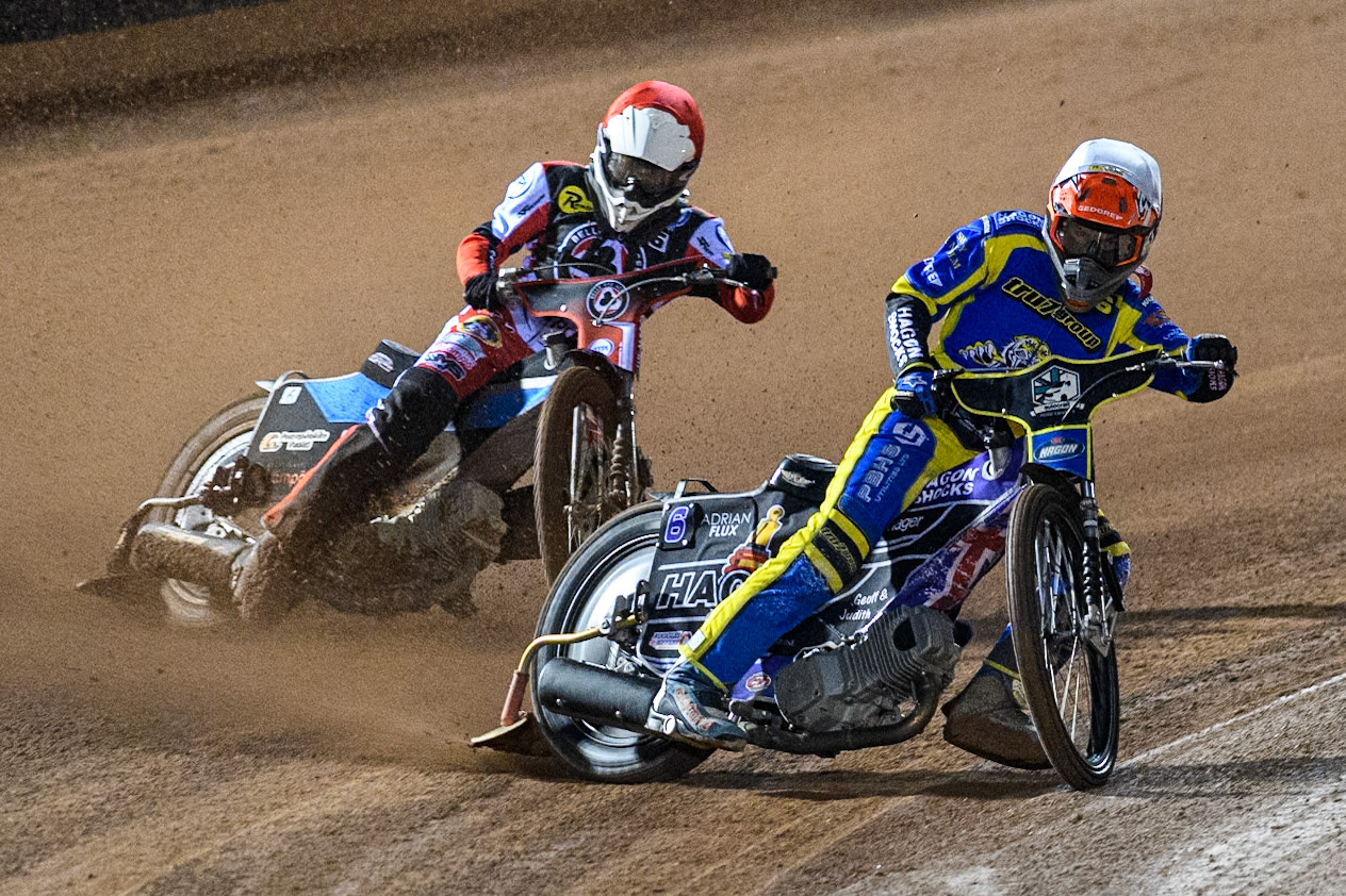 Sheffield Tigers' Jason Edwards in White leading Belle Vue Aces' Antti Vuolas  in Red during the Rowe Motor Oil Premiership Play Off Semi Final 2, 1st Leg match between Belle Vue Aces and Sheffield Tigers at the National Speedway Stadium, Manchester on Monday 16th September 2024. (Photo: Ian Charles | MI News)