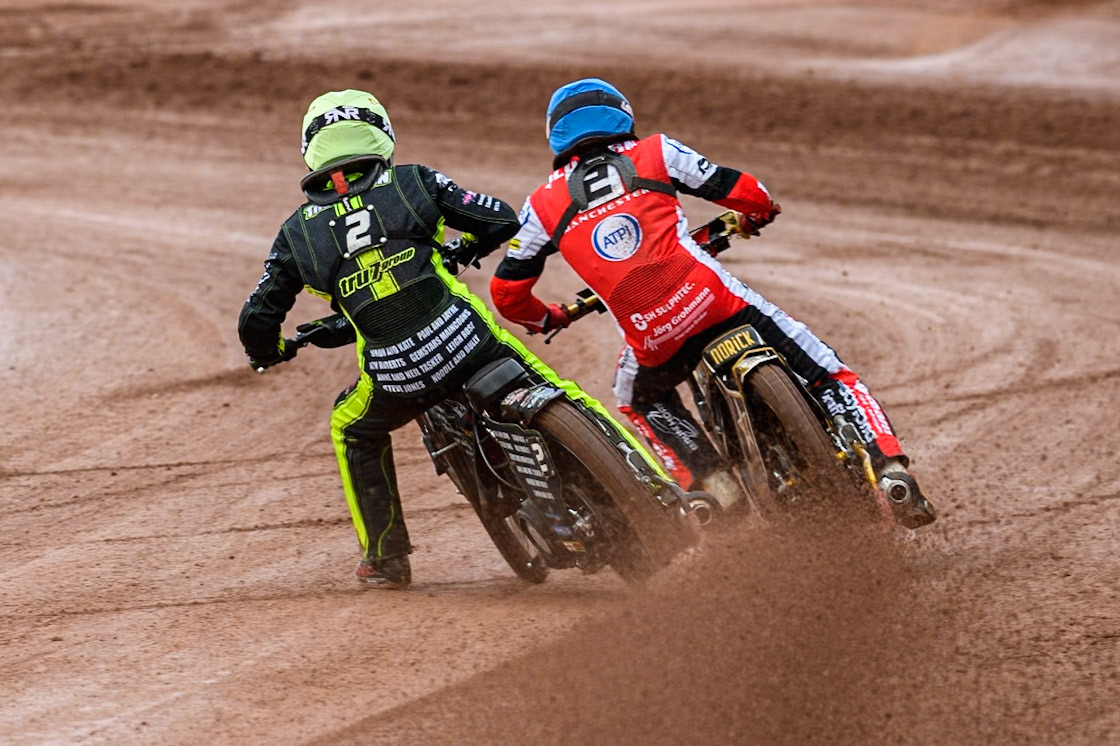 Ipswich Witches' Dan Thompson in Yellow chases Belle Vue Aces' Norick Blodorn  in Blue during the Rowe Motor Oil Premiership match between Belle Vue Aces and Ipswich Witches at the National Speedway Stadium, Manchester on Monday 1st July 2024. (Photo: Ian Charles | MI News)