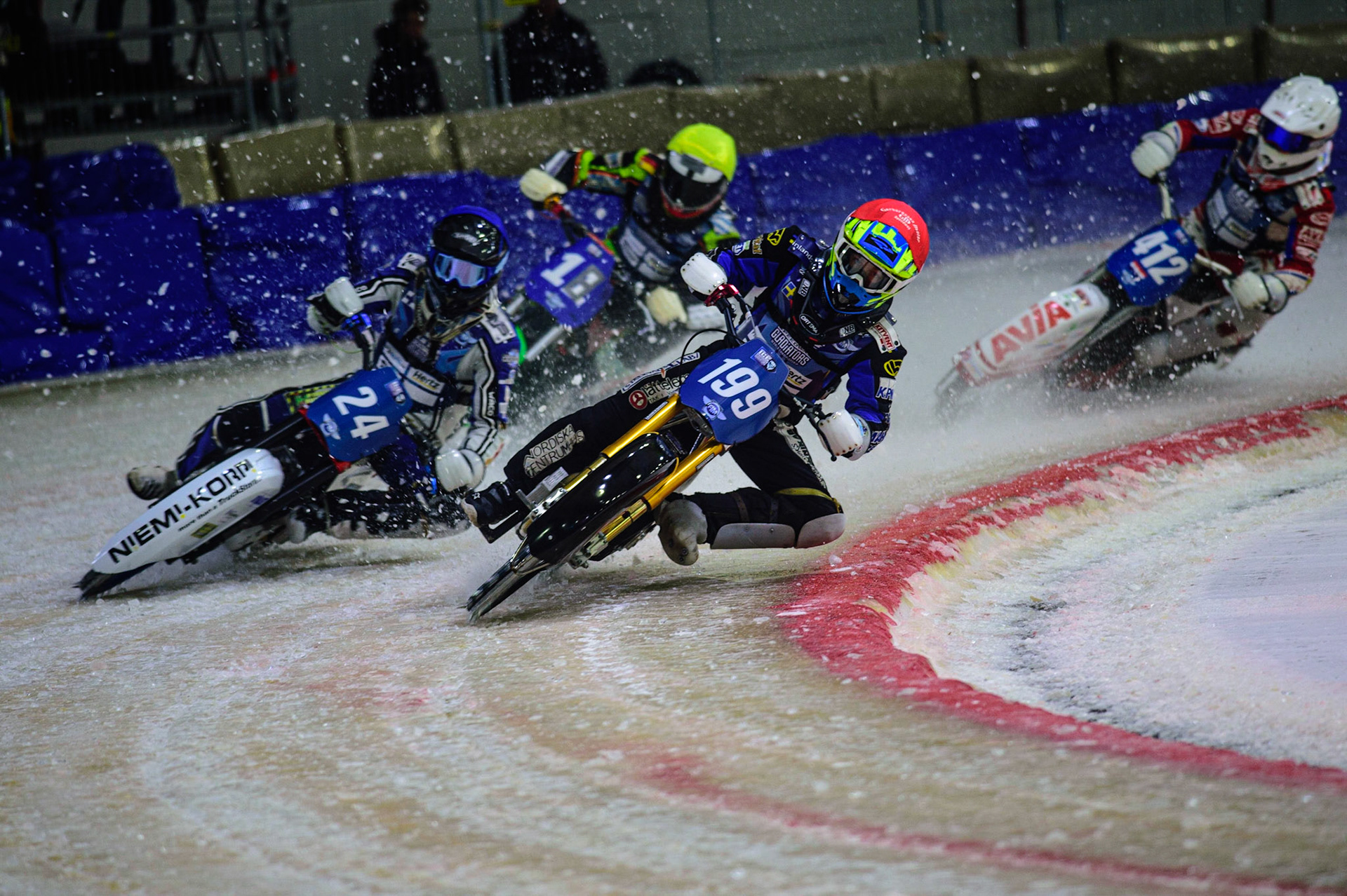 HEERENVEEN, NL. Martin Hååruhiltunen (199)  (Red) leads Max Koivula (24) (Blue) Benedict Monn (18) (Yellow) and Niek Schaap (412) (White)  during the FIM Ice Speedway Gladiators World Championship Final 4 at Ice Rink Thialf, Heerenveen on Sunday  3 April 2022. (Credit: Ian Charles | MI News)