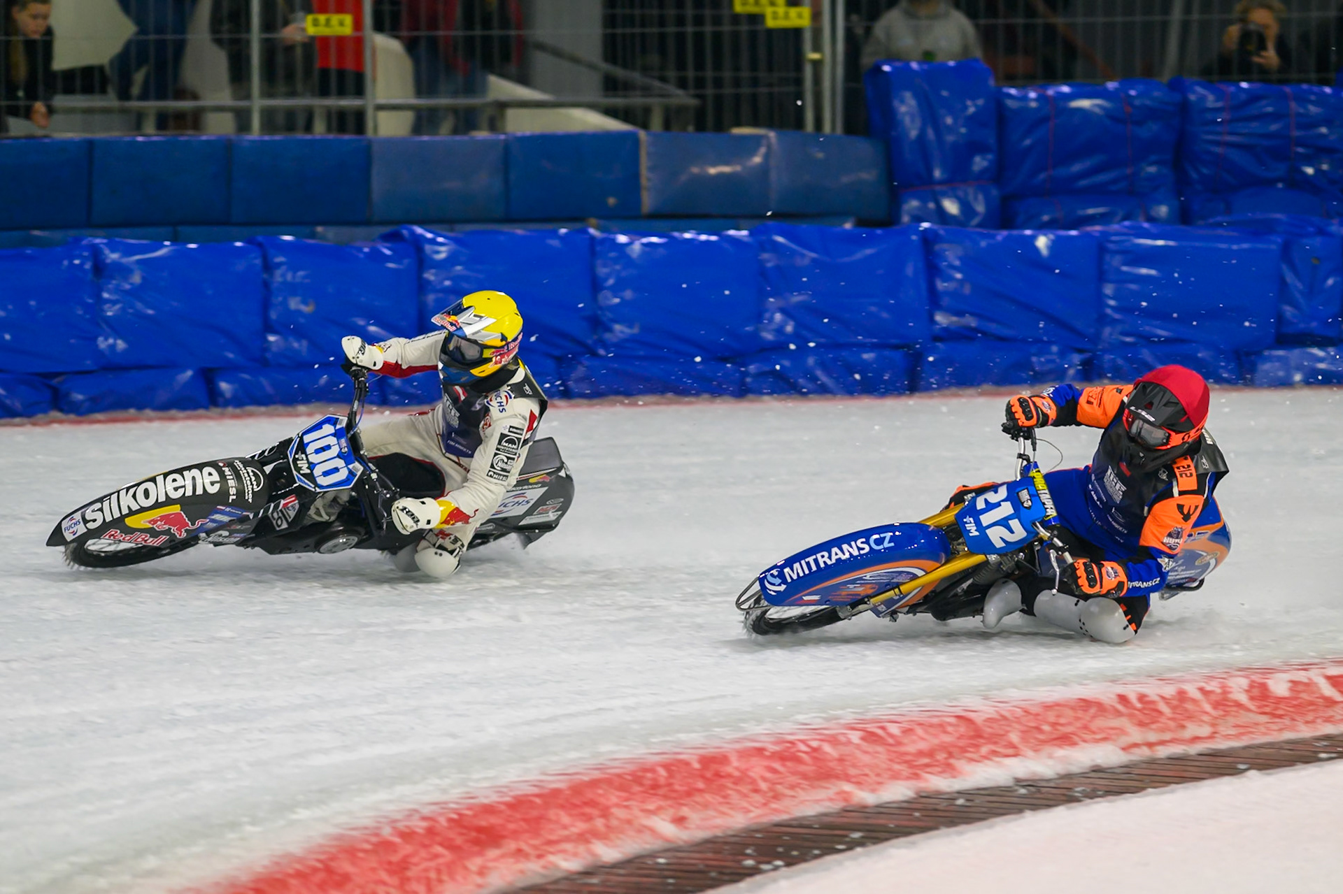 Lukas Hutla (212) of Czechia in Red rides inside Franz Zorn (100) of Austria in Yellow during the FIM Ice Speedway Gladiators World Championship Final 3 at Ice Rink Thialf, Heerenveen on Saturday 11th April 2026. (Photo: Ian Charles | MI News)