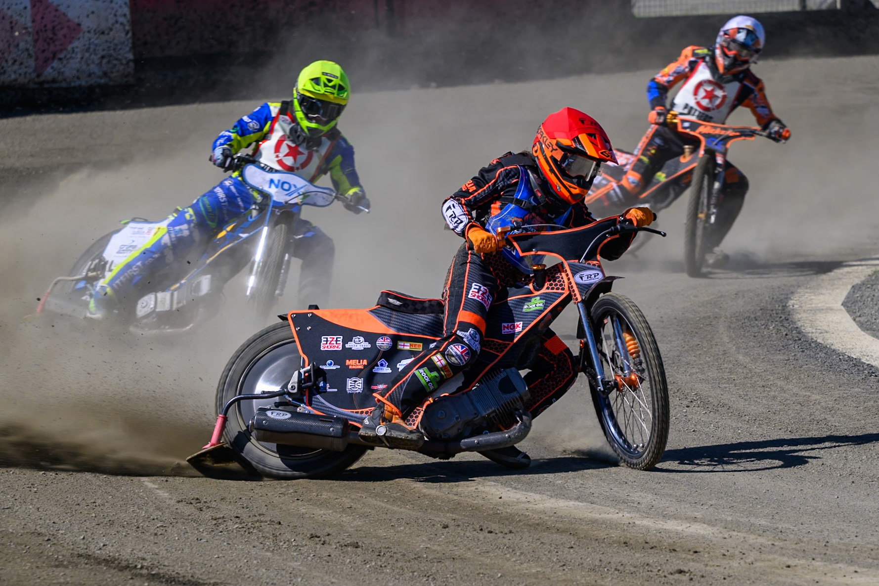 Jack Smith of Buxton Bulls in Red leading Will Boraston of Stoke Potters in Yellow and Mickie Simpson of Stoke Potters  in White during the National Development League Challenge match between Buxton Bulls and Stoke Potters at Hi-Edge Speedway, Buxton on Sunday 24th May 2026. (Photo: Ian Charles | MI News)