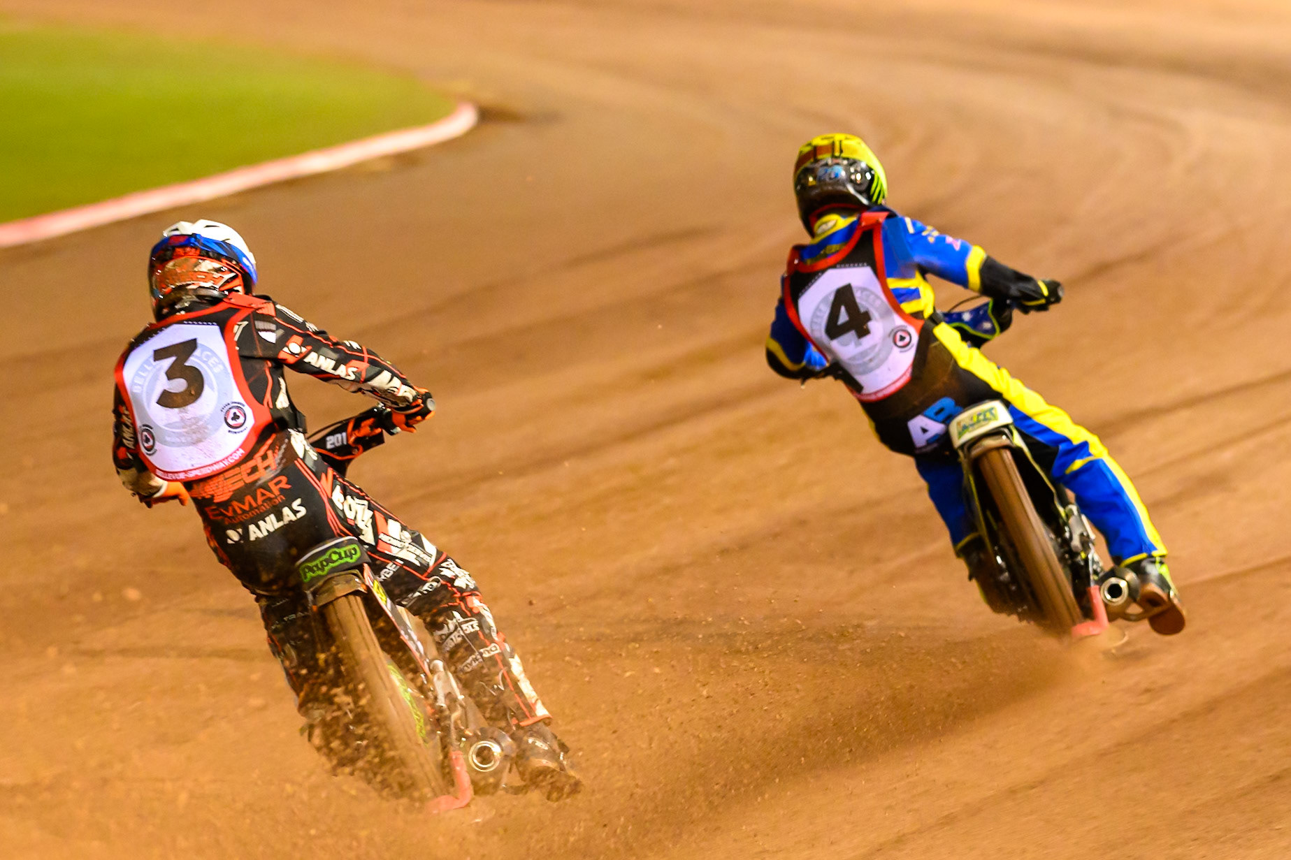Jan Kvech in White chases Chris Holder   in Yellow during the Peter Craven Memorial Trophy at the National Speedway Stadium, Manchester, on Monday 16th March 2026. (Photo: Ian Charles | MI News)