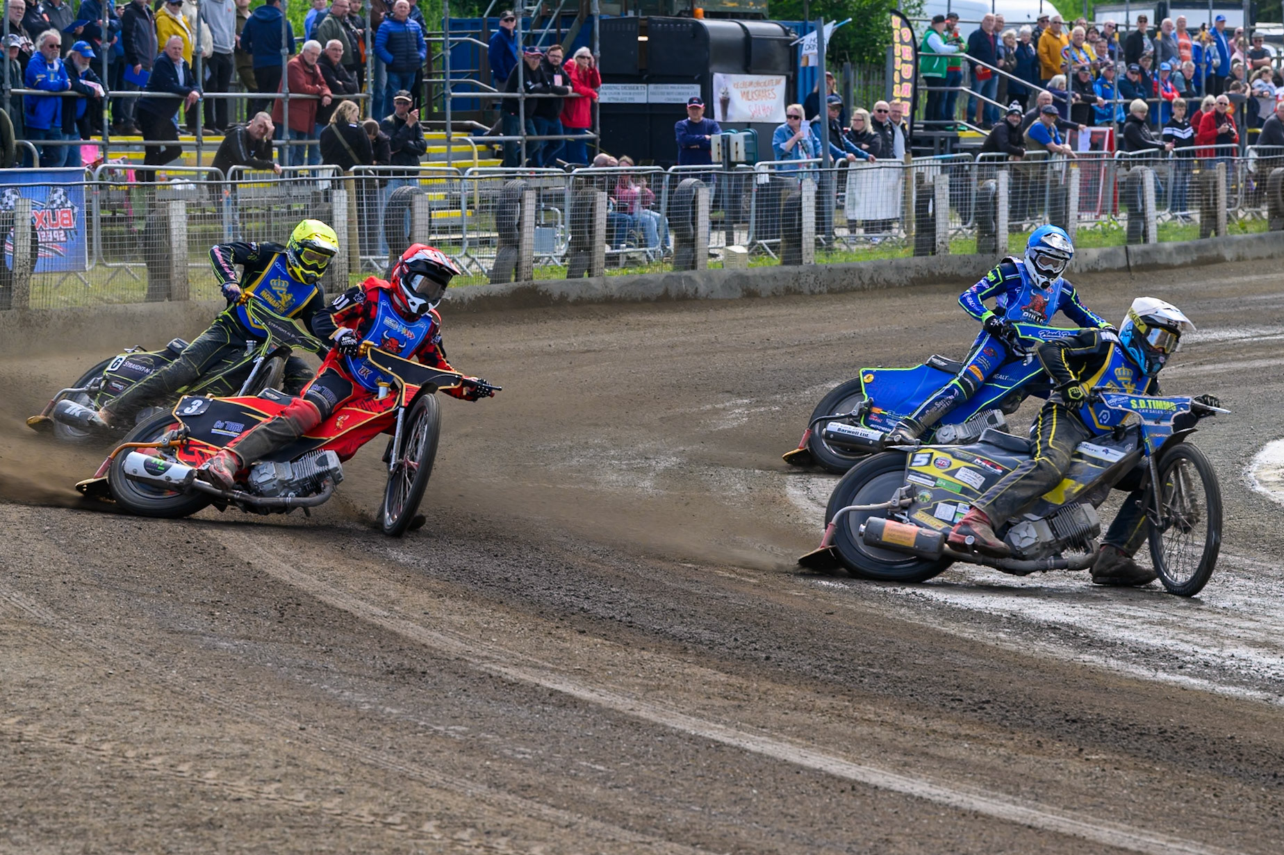 Dayle Wood of Edinburgh Monarchs Academy in White leading Luke Harris of Buxton Bulls in Red, Arran Butcher of Buxton Bulls in Blue and Ben Whalley of Edinburgh Monarchs Academy in Yellow during the WSRA National Development League match between Buxton Bulls and Edinburgh Monarchs Academy at Hi-Edge Speedway, Buxton on Sunday 14th June 2026. (Photo: Ian Charles | MI News)