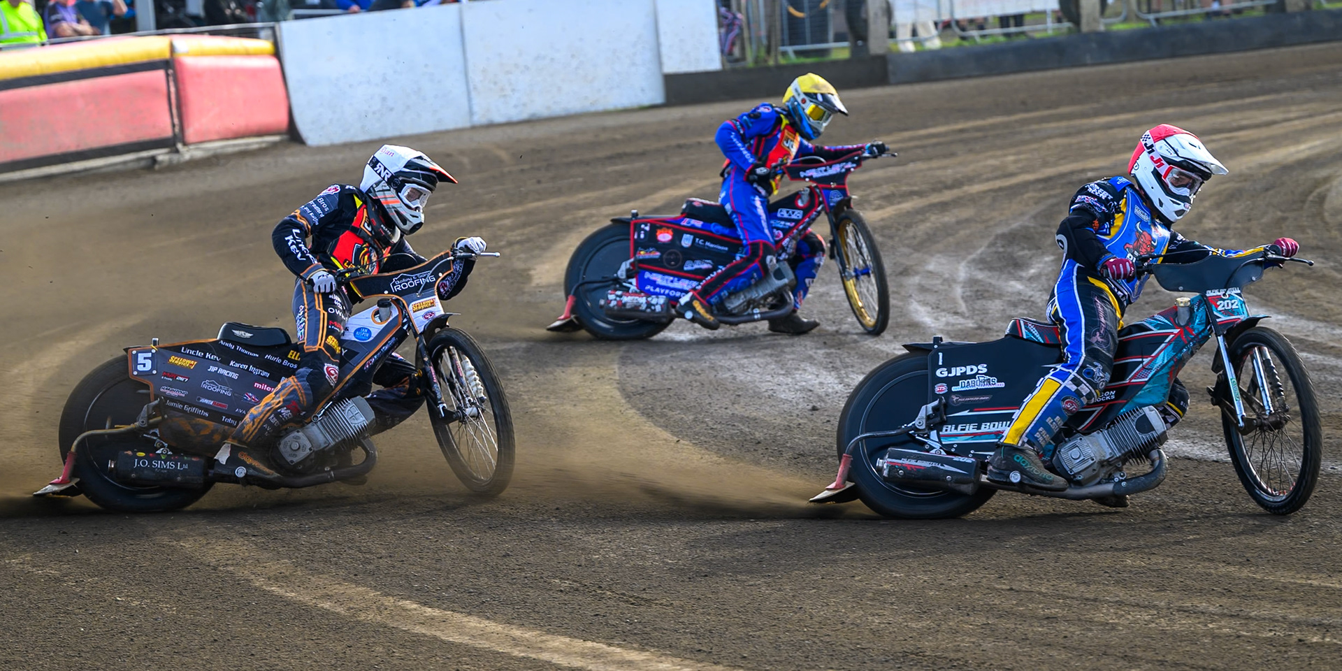 Alfie Bowtell of Buxton Bulls  in Red leading Ryan Ingram of Leicester Lion Cubs   in White  and Emerson Betty, Guest rider for Leicester Lion Cubs  in Yellow during the WSRA National Development League match between Buxton Bulls and Leicester Lion Cubs at Hi-Edge Speedway, Buxton on Sunday 4th October 2026. (Photo: Ian Charles | MI News)