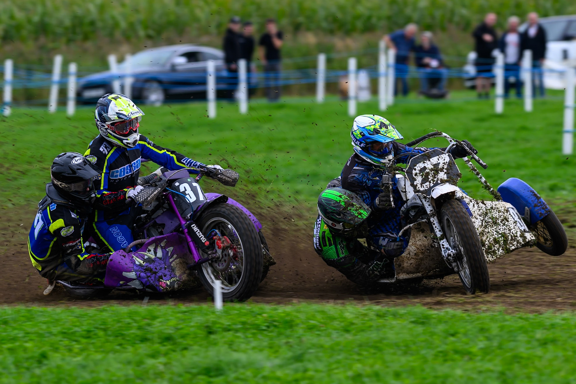 British Masters 1000cc Sidecars: Rob Bradley/Billy Winterburn (87) lifts the third wheel ahead of Mark Cossar/Wayne Rickards (37)  during the British Masters Grasstrack Championship at Lower Marsh Farm, Much Hoole, Preston in Lancashire, England on Sunday 13th September 2026. (Photo: Ian Charles | MI News)
