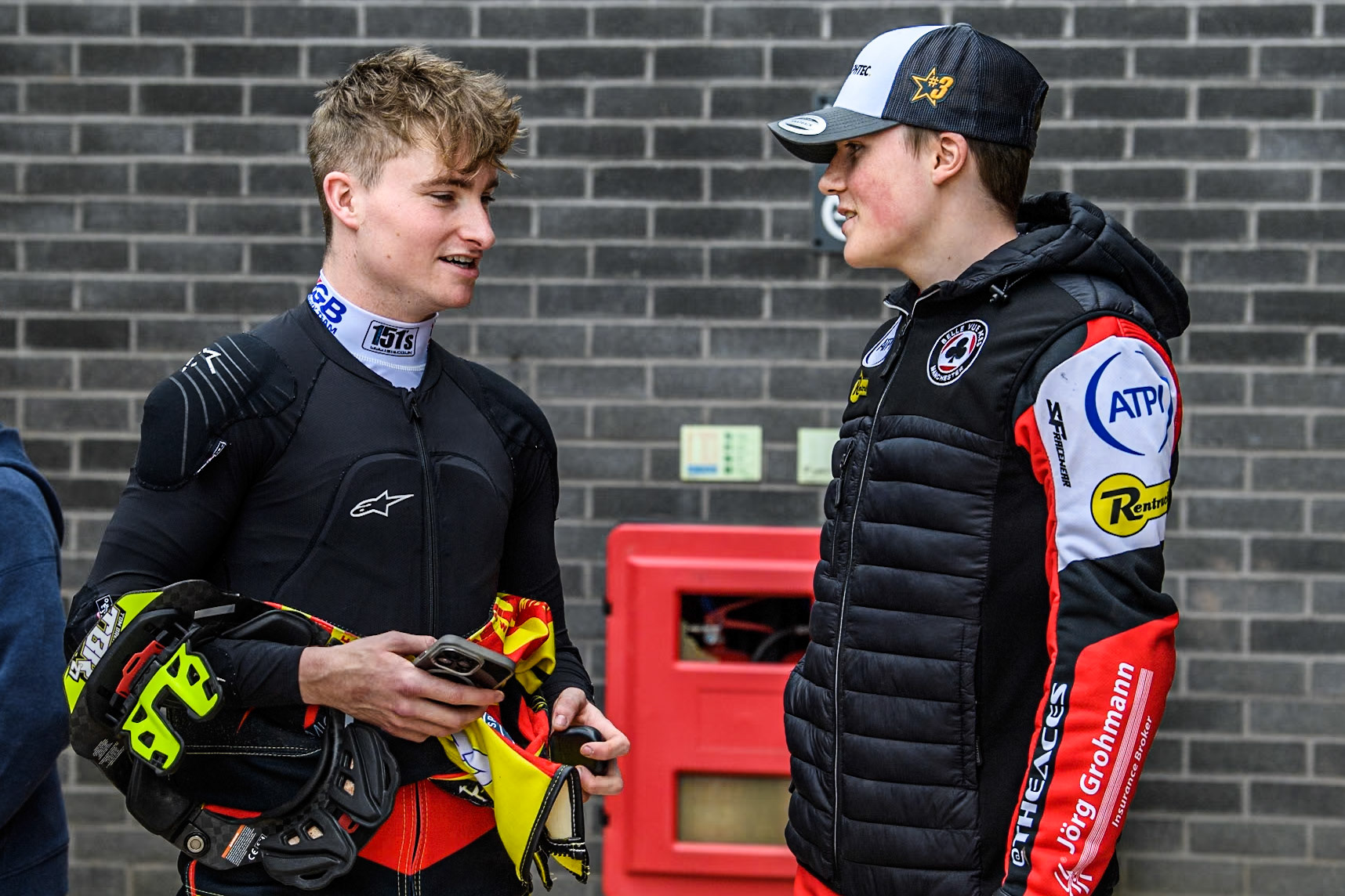 Birmingham Brummies' Tom Brennan  (Left) chats with Belle Vue Aces' Norick Blödorn during the Rowe Motor Oil Premiership match between Belle Vue Aces and Birmingham Brummies at the National Speedway Stadium, Manchester on Monday 6th May 2024. (Photo: Ian Charles | MI News)