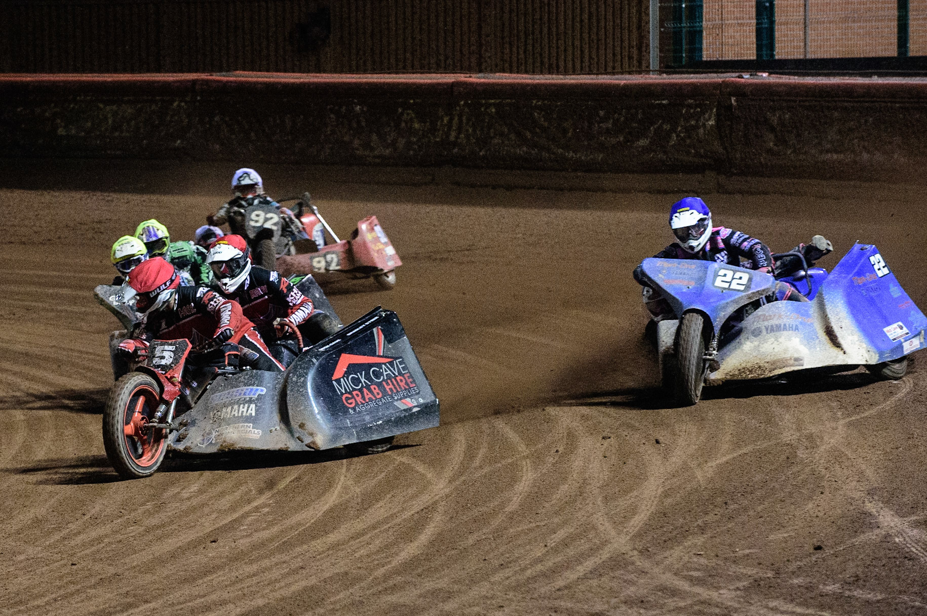 MANCHESTER, UK. OCT 30TH   Mick Cave &amp; Bradley Steer  (Red) leads Will Penfold &amp; Ricky Pay  (Blue) Gareth Winterburn &amp; Bradley Atkinson  (Yellow) and Paul Whitelam &amp; Richard Webb (White) in the last chance semi final during the Manchester Masters Sidecar Speedway and Flat Track Racing at the National Speedway Stadium, Manchester on Saturday 30th October 2021. (Credit: Ian Charles | MI News)