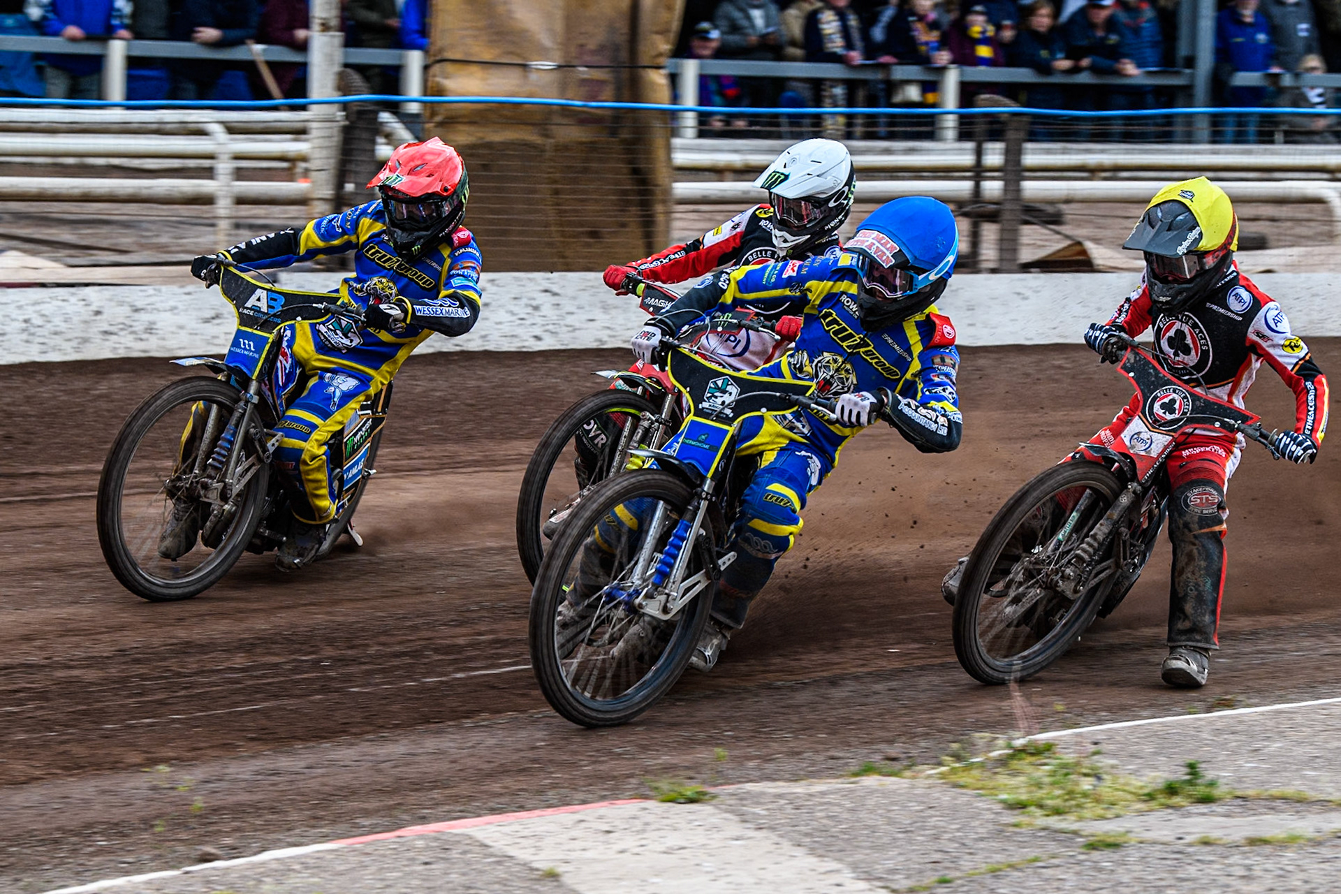 Anders Rowe of Sheffield Tigers in Blue and Jack Holder of Sheffield Tigers in Red leading Zach Cook of Belle Vue Aces in Yellow and Jaimon Lidsey of Belle Vue Aces in White during the Rowe Motor Oil Premiership match between Sheffield Tigers and Belle Vue Aces at Owlerton Stadium, Sheffield on Monday 5th May 2025. (Photo: Ian Charles | MI News)