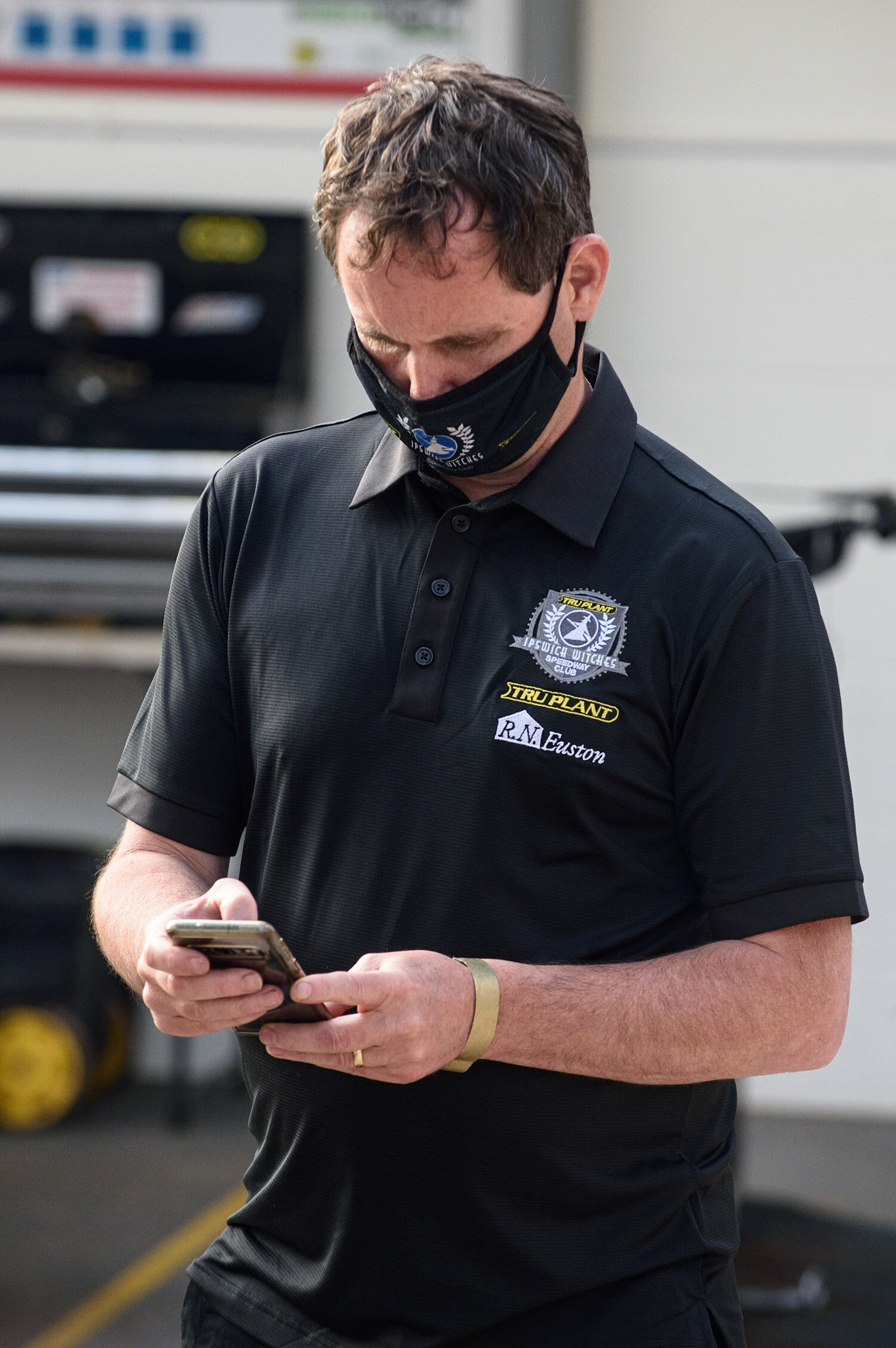MANCHESTER, UK. JUNE 7TH   Ipswich TruPlant Witches  manager Chris Louis  checks his phone during the SGB Premiership match between Belle Vue Aces and Ipswich Witches at the National Speedway Stadium, Manchester on Monday 7th June 2021. (Credit: Ian Charles | MI News)