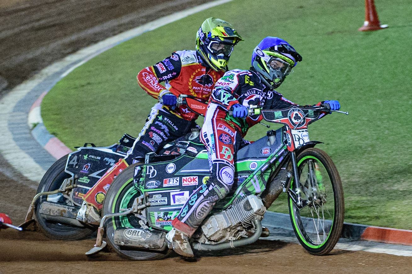 MANCHESTER, UK. OCT 11TH  Charles Wright  (Blue) \holds off Scott Nicholls  (Yellow) during the SGB Premiership Grand Final 1st Leg between Belle Vue Aces and Peterborough Panthers at the National Speedway Stadium, Manchester on Monday 11th October 2021. (Credit: Ian Charles | MI News)