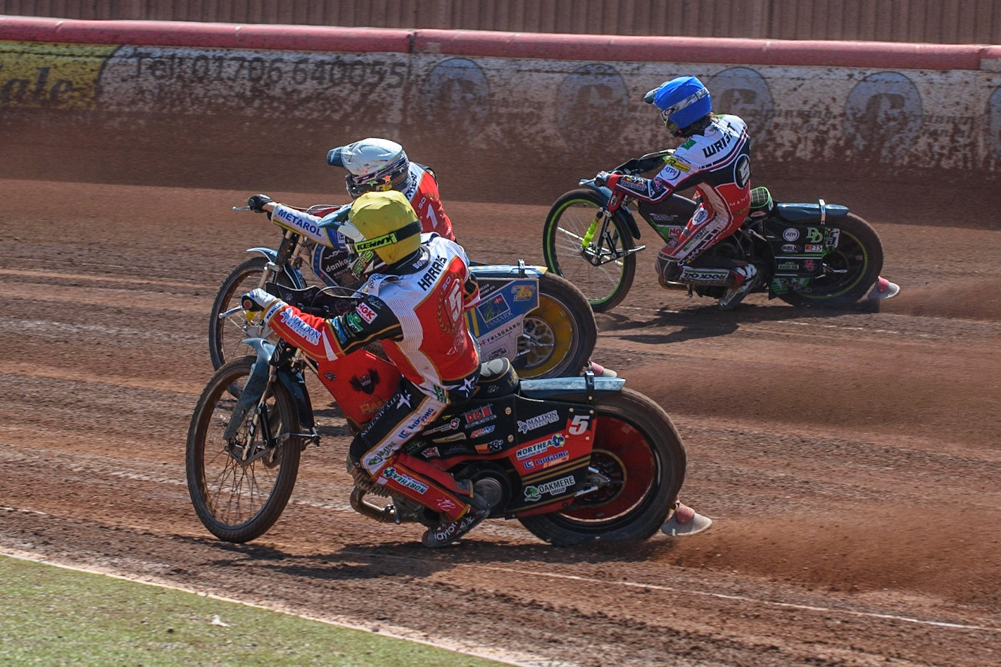 MANCHESTER, UK. MAY 31ST  Chris Harris  (Yellow) and Bjarne Pedersen (White) inside Charles Wright  (Blue) during the SGB Premiership match between Belle Vue Aces and Peterborough at the National Speedway Stadium, Manchester on Monday 31st May 2021. (Credit: Ian Charles | MI News)