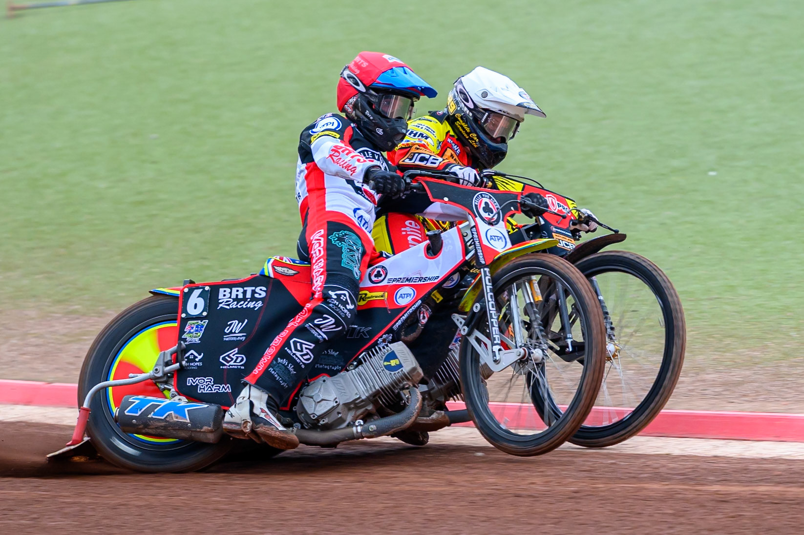 Tate Zischke of Belle Vue Aces in Red battles with Kyle Howarth of Leicester Lions in White during the Rowe Motor Oil Premiership match between Belle Vue Aces and Leicester Lions at the National Speedway Stadium, Manchester on Monday 15th June 2026. (Photo: Ian Charles | MI News)