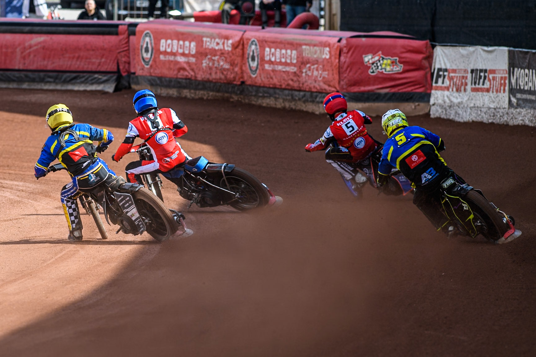 Sheffield Tigers' Guest Rider Tom Brennan  in White and Sheffield Tigers' Guest Rider Joe Thompson  in Yellow chases Belle Vue Aces' Brady Kurtz  in Red and Belle Vue Aces' Antti Vuolas  in Blue during the Rowe Motor Oil Premiership match between Belle Vue Aces and Sheffield Tigers at the National Speedway Stadium, Manchester on Monday 26th August 2024. (Photo: Ian Charles | MI News)