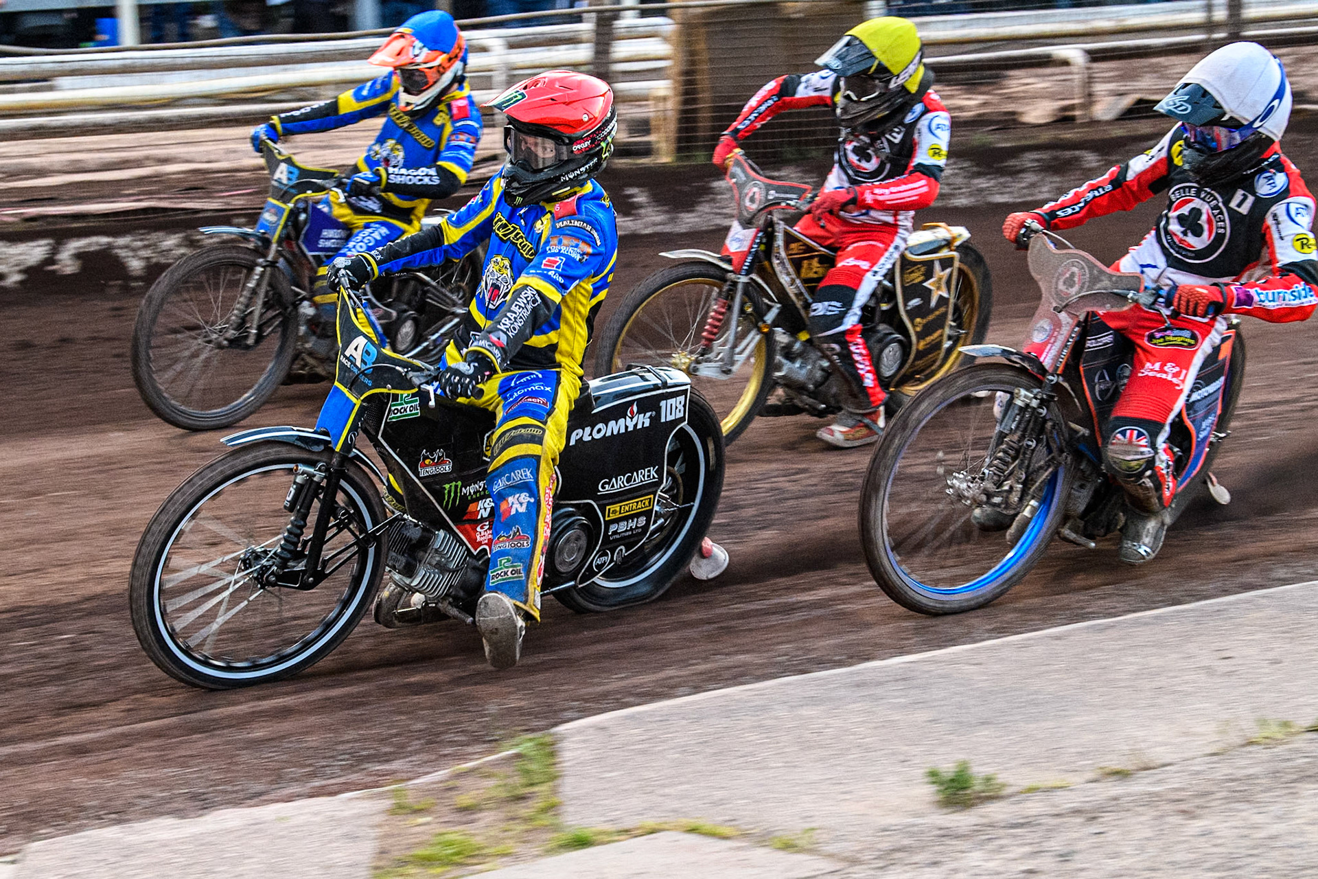 Sheffield Tigers' Tai Woffinden  in Red and Sheffield Tigers' Jason Edwards  in Blue leading Belle Vue Aces' Brady Kurtz  in White and Belle Vue Aces' Norick Blodorn  in Yellow during the Premiership KO Cup Quarter Final, 2nd Leg match between Sheffield Tigers and Belle Vue Aces at Owlerton Stadium, Sheffield on Thursday 9th May 2024. (Photo: Ian Charles | MI News)