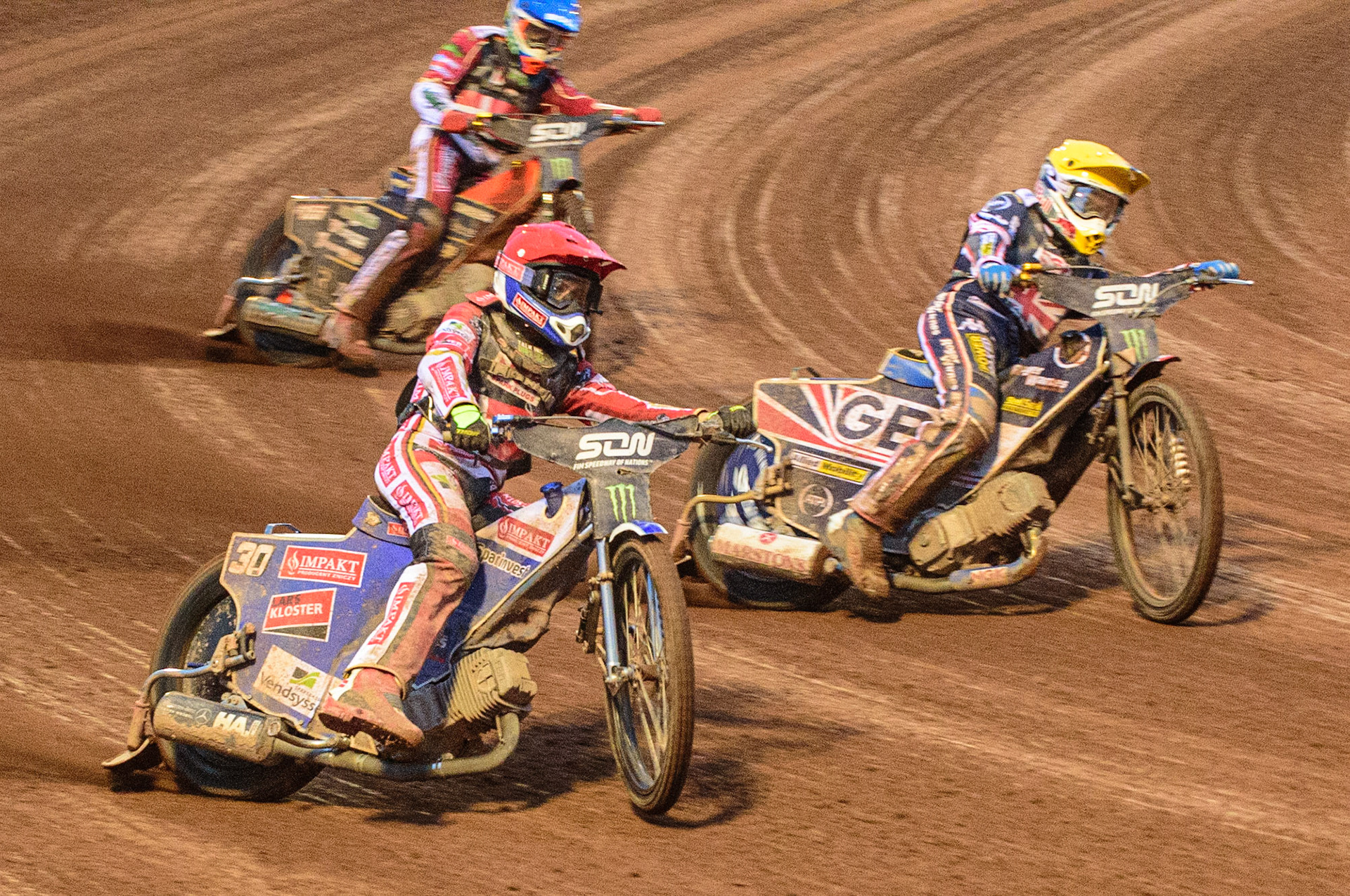 MANCHESTER, UK. OCT 17TH Robert Lambert of Great Britain inside (Yellow) inside Leon Madsen of Denmark (Red) with Mikkel Michelsen of Denmark (Blue) behind during the Monster Energy FIM Speedway of Nations at the National Speedway Stadium, Manchester on Sunday  17th October 2021. (Credit: Ian Charles | MI News)