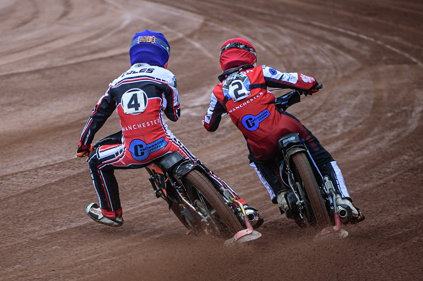 MANCHESTER, UK. APR 15TH Sam McGurk  (Red) passes his team mate Connor Coles  (Blue) during the National Development League match between Belle Vue Colts and Plymouth Centurions at the National Speedway Stadium, Manchester on Friday 15th April 2022. (Credit: Ian Charles | MI News)
