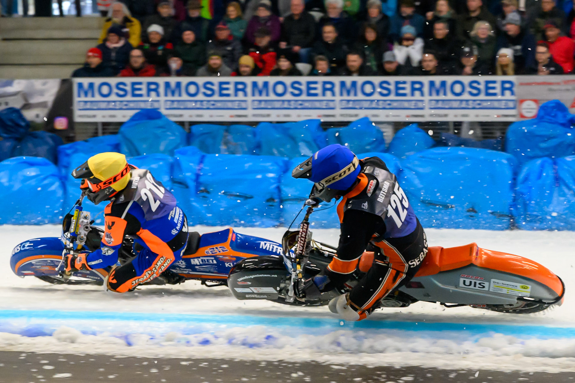 Lukas Hutla (212) of Czechia  in Yellow leading Sebastian Reitsma (125) of The Netherlands  in Blue during the Ice Speedway Gladiators World Championship Final 2 at Max-Aicher-Arena, Inzell on Sunday 15th March 2026. (Photo: Ian Charles | MI News)