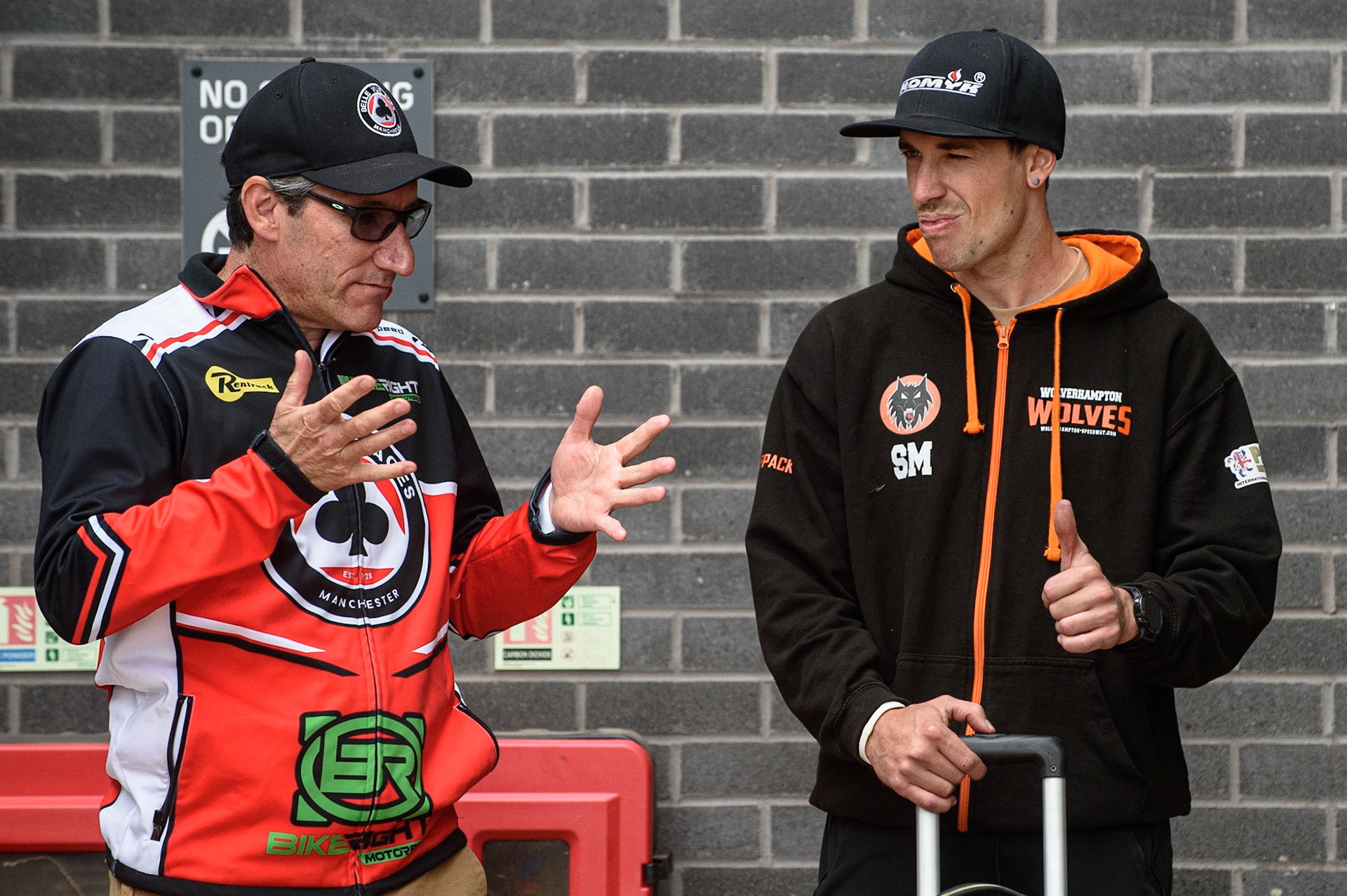 MANCHESTER, UK. AUGUST 30TH Belle Vue BikeRight Aces  manager Mark Lemon (left)  chats with fellow Australia Sam Masters  during the SGB Premiership match between Belle Vue Aces and Wolverhampton Wolves at the National Speedway Stadium, Manchester on Monday 30th August 2021. (Credit: Ian Charles | MI News)