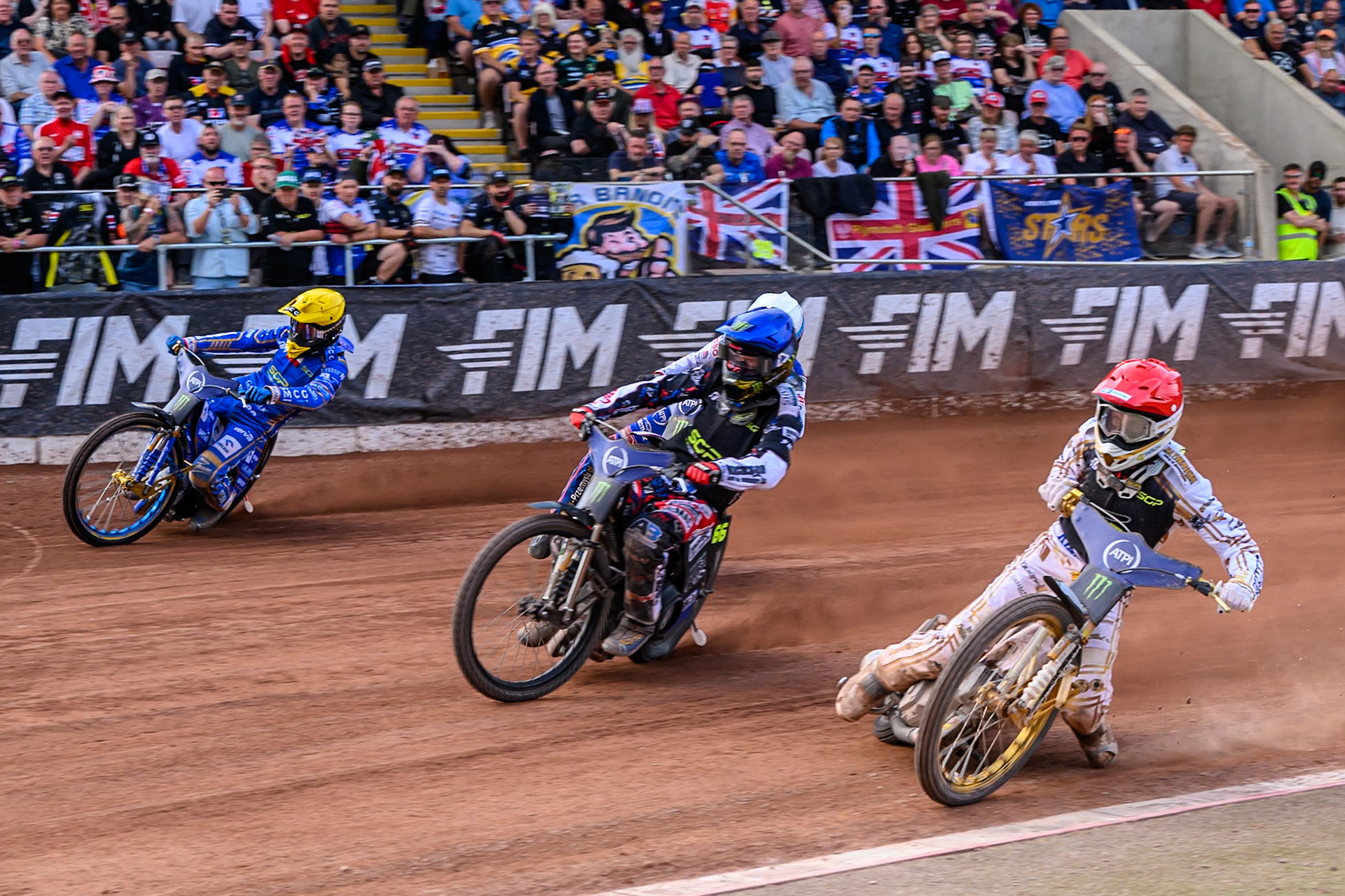 Mikkel Michelsen (155) of Denmark in Red on the inside  of Fredrik Lindgren (66) of Sweden in Blue, Dan Bewley (99) of Great Britain in White and Bartosz Zmarzlik (95) of Poland in Yellow during the ATPI FIM Speedway Grand Prix Round 4 at the National Speedway Stadium, Manchester, on Friday 13th June 2025. (Photo: Ian Charles | MI News)