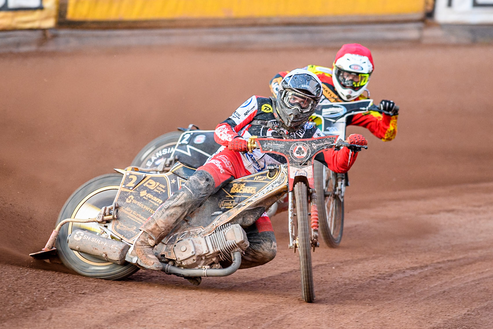Belle Vue Aces' Norick Blodorn in White leading Leicester Lions' Richard Lawson in Red during the Rowe Motor Oil Premiership match between Leicester Lions and Belle Vue Aces at the Pidcock Motorcycles Arena, Leicester on Thursday 25th July 2024. (Photo: Ian Charles | MI News)