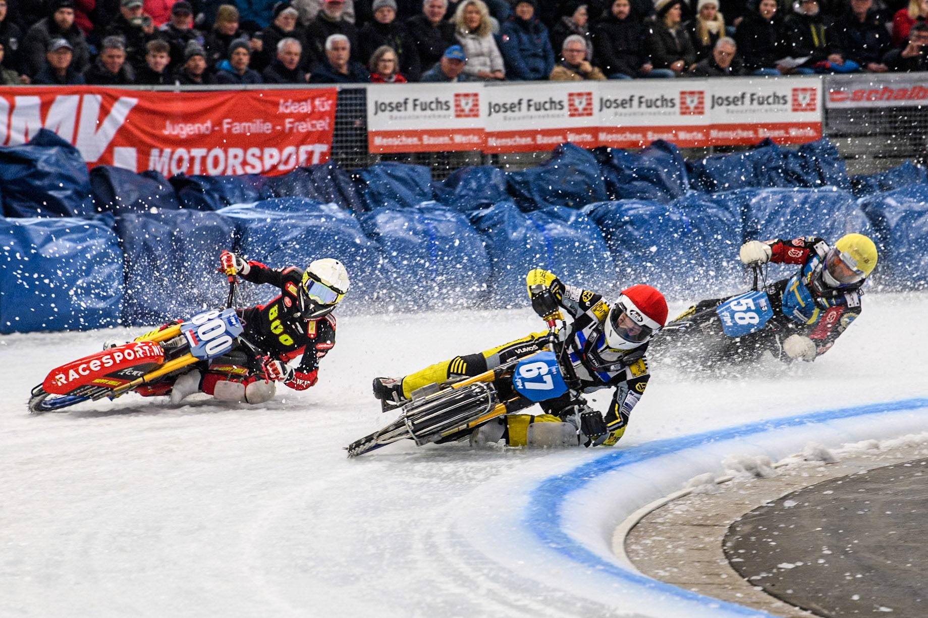 Finland's Heikki Huusko (67) (Red) inside Netherlands' Jasper Iwema (800) (White) with Sweden's Stefan Svensson (58) behind during the FIM Ice Speedway Gladiators World Championship Final 2 at the Max-Aicher-Arena, Inzell on Sunday 24 March 2024. (Photo: Ian Charles | MI News)