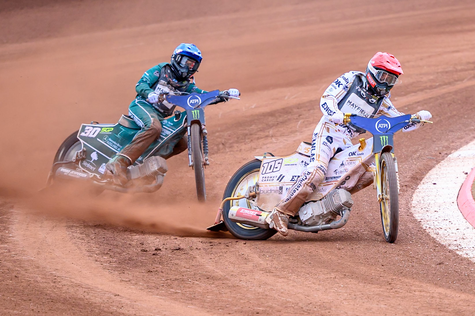 Anders Thomsen (105) of Denmark in Red leading Leon Madsen (30) of Denmark in Blue during the ATPI  FIM Speedway GP of Manchester at the National Speedway Stadium, Manchester on Saturday 6th June 2026. (Photo: Ian Charles | MI News)