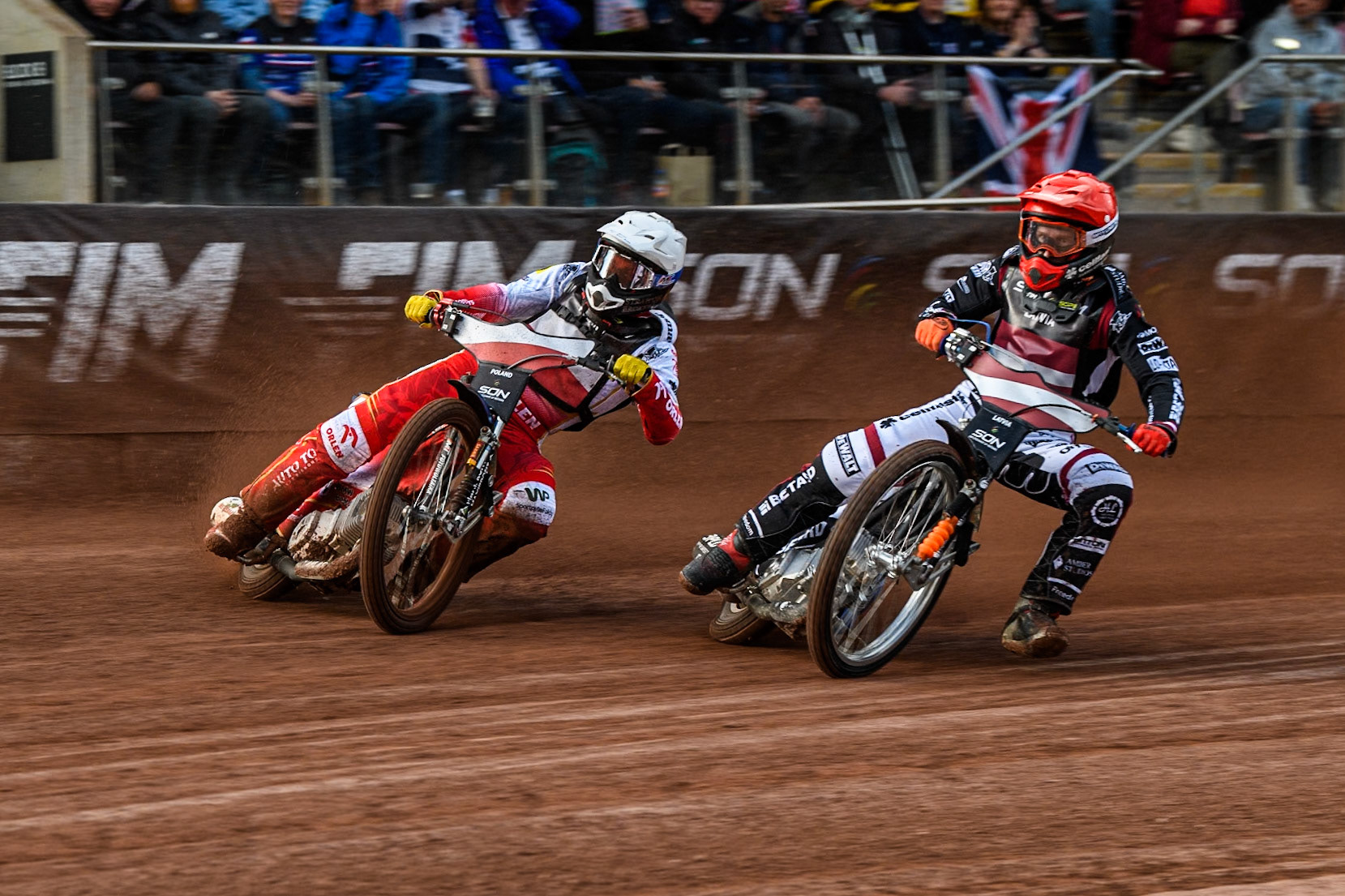 Dominik Kubera of Poland in White rides outside Andzejs Lebedevs of Latvia in Red during the Monster Energy FIM Speedway of Nation Final at the National Speedway Stadium, Manchester on Saturday 13th July 2024. (Photo: Ian Charles | MI News)