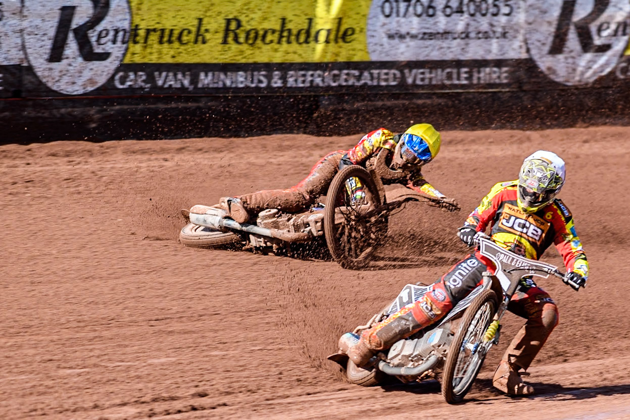 Leicester Lion Cubs' Sonny Springer  (Yellow) falls behind team mate Leicester Lion Cubs' Luke Crang (White) during the WSRA  National Development League match between Belle Vue Colts and Leicester Lion Cubs at the National Speedway Stadium, Manchester on Friday 29th March 2024. (Photo: Ian Charles | MI News)