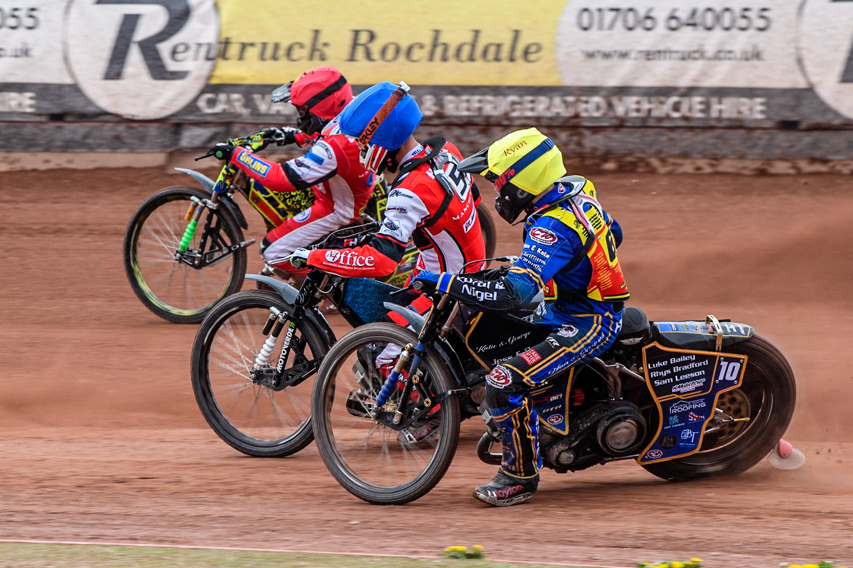 Leicester Lion Cubs' Ryan Ingram  in Yellow rides inside Belle Vue Colts' Freddy Hodder in Blue and Belle Vue Colts' William Cairns in Red during the WSRA National Development League match between Belle Vue Colts and Leicester Lion Cubs at the National Speedway Stadium, Manchester on Friday 18th April 2025. (Photo: Ian Charles | MI News)