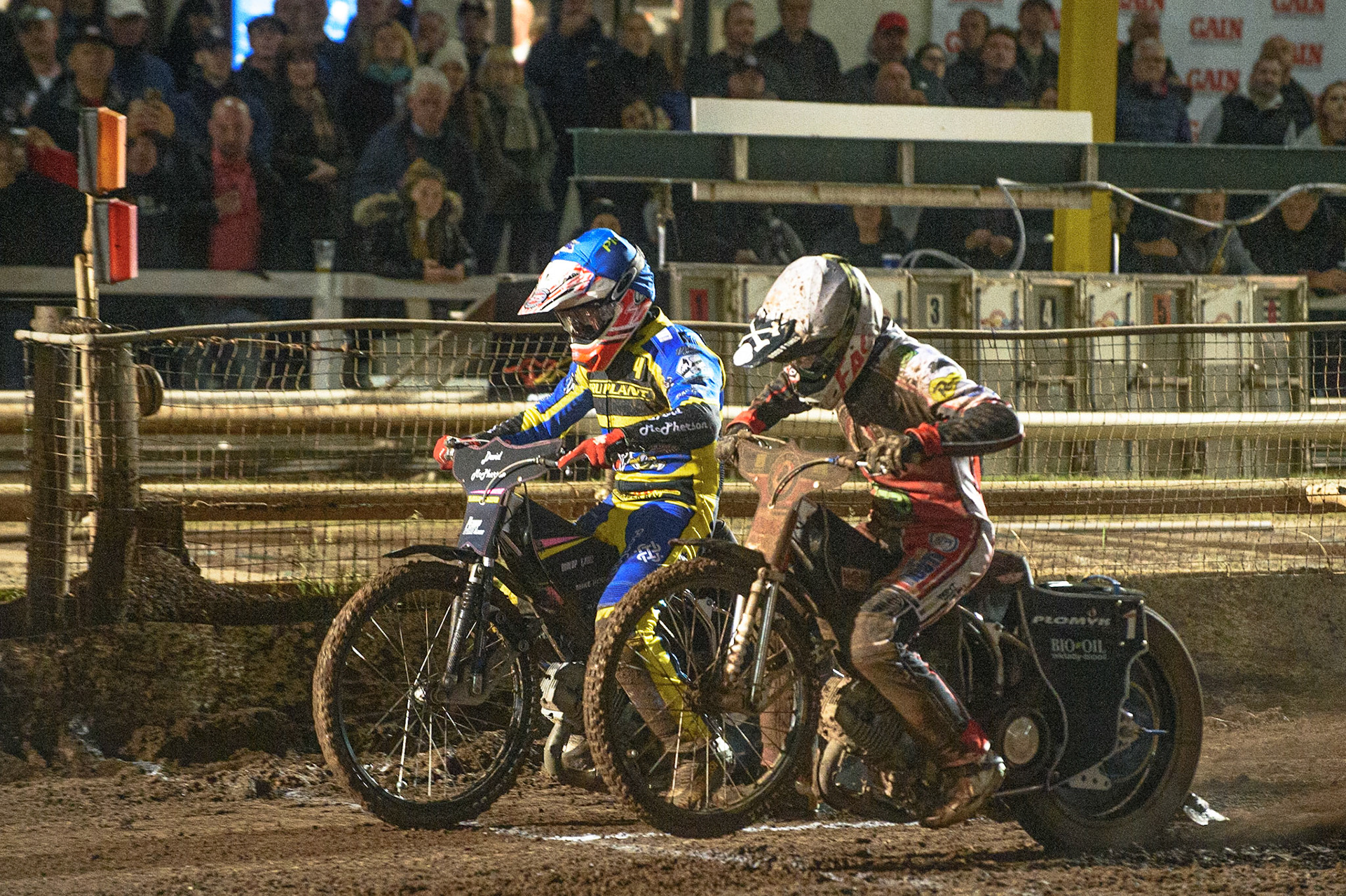 SHEFFIELD, UK. OCT 4THJosh Pickering  (Blue) and Dan Bewley  (White) leave the gate during the SGB Premiership Semi Final Playoff 1st Leg between Sheffield Tigers and Belle Vue Aces at Owlerton Stadium, Sheffield on Monday 4th October 2021. (Credit: Ian Charles | MI News)