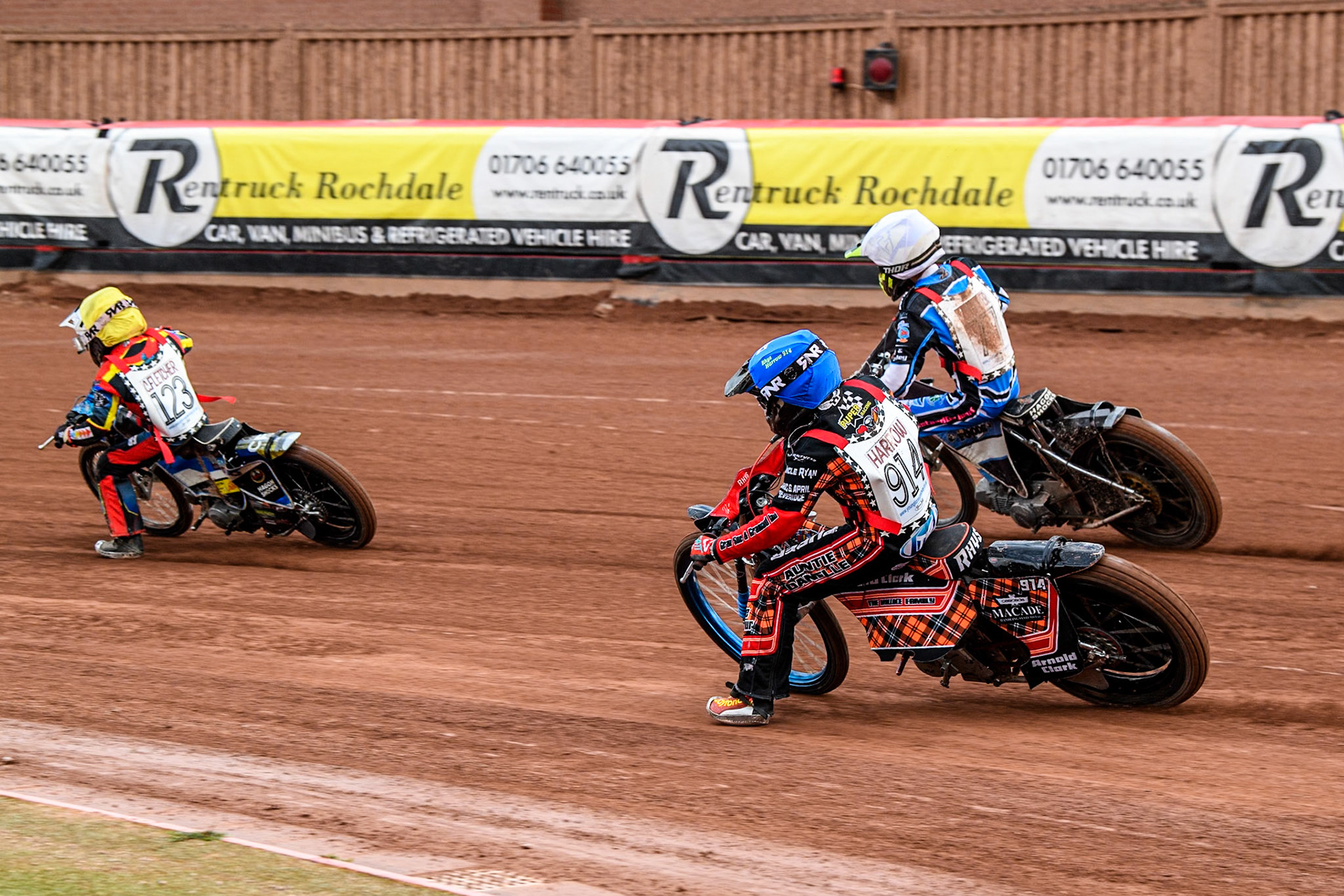 Rhys Harrow (125cc)  in Blue chases Jack Scully-Syer (125cc)  in White and Charlie Fletcher (125cc)  in Yellow during the British Youth 500cc Championships at the National Speedway Stadium, Manchester on Friday 2nd August 2024. (Photo: Ian Charles | MI News)