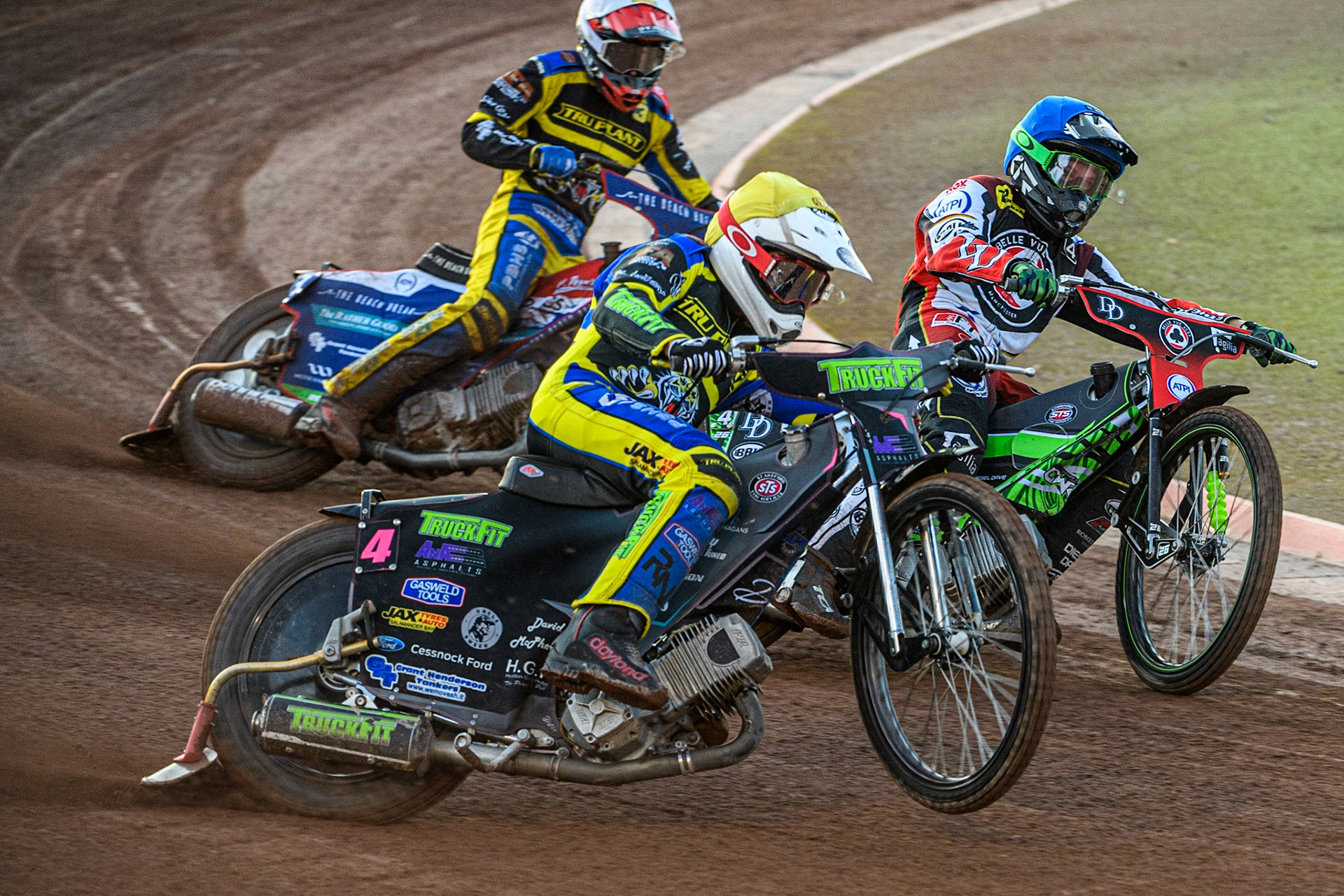 Josh Pickering (Yellow) outside Charles Wright (Blue) with Adam Ellis (White) behind during the Sports Insure Premiership match between Belle Vue Aces and Sheffield Tigers at the National Speedway Stadium, Manchester on Monday 7th August 2023. (Photo: Ian Charles | MI News)