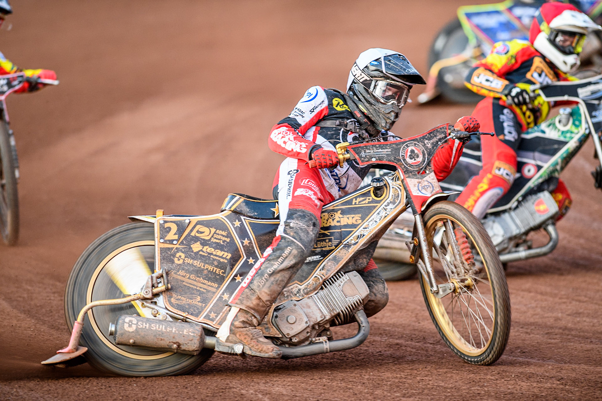Belle Vue Aces' Norick Blodorn in White rides outside Leicester Lions' Richard Lawson during the Rowe Motor Oil Premiership match between Leicester Lions and Belle Vue Aces at the Pidcock Motorcycles Arena, Leicester on Thursday 25th July 2024. (Photo: Ian Charles | MI News)