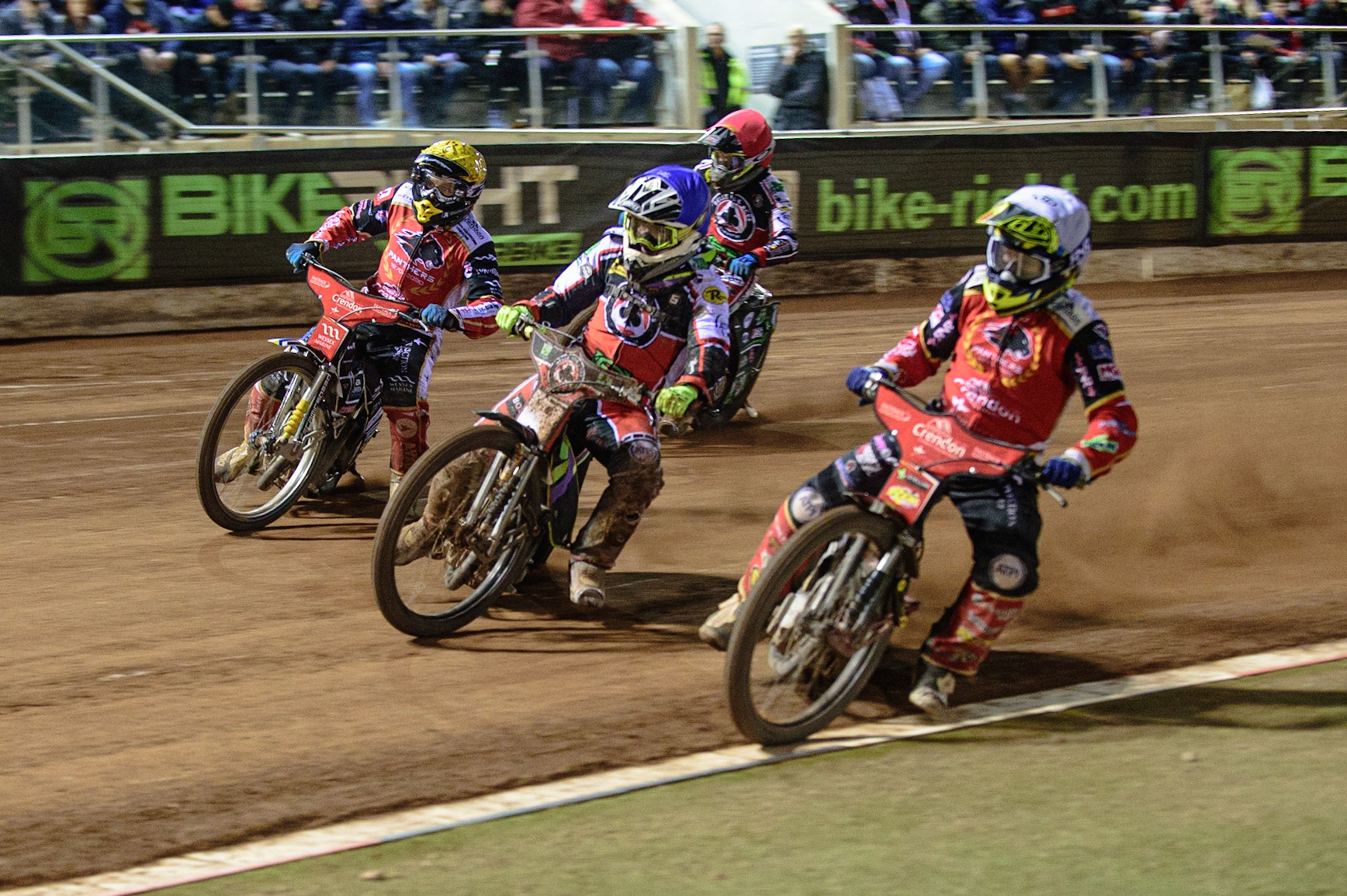 MANCHESTER, UK. OCT 11TH  Scott Nicholls  (White) takes the inside line from Tom Brennan  (Blue) and Bjarne Pedersen  (Yellow) with Charles Wright  (Red) behind during the SGB Premiership Grand Final 1st Leg between Belle Vue Aces and Peterborough Panthers at the National Speedway Stadium, Manchester on Monday 11th October 2021. (Credit: Ian Charles | MI News)