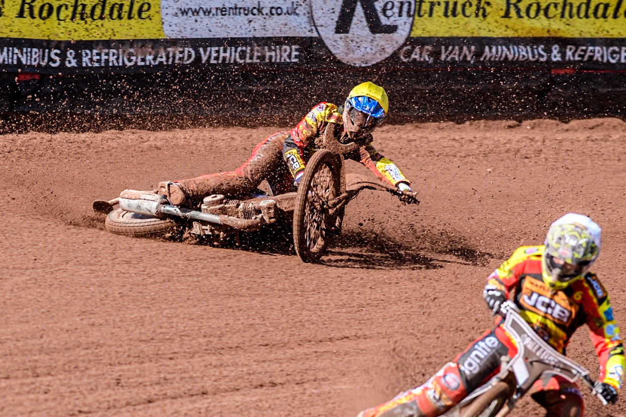 Leicester Lion Cubs' Sonny Springer  (Yellow) falls behind team mate Leicester Lion Cubs' Luke Crang (White) during the WSRA  National Development League match between Belle Vue Colts and Leicester Lion Cubs at the National Speedway Stadium, Manchester on Friday 29th March 2024. (Photo: Ian Charles | MI News)