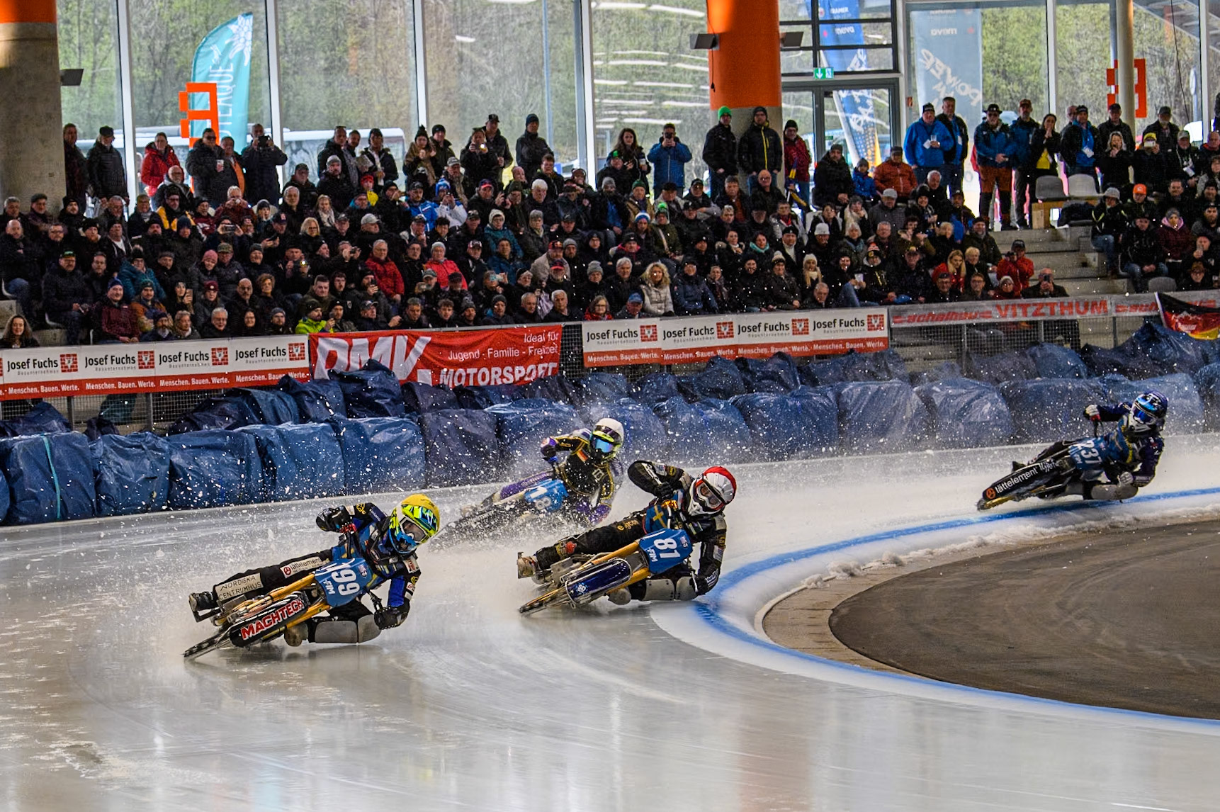 Sunday’s opening heat as Sweden's Martin Haarahiltunen (199)  (Yellow) leads  Sweden"s Jimmy Olsén (81) (Red) Germany's Christoph Kirchner (18) (White) and Sweden's Jimmy Hörnell Lidfalk (237) (Blue)  during the FIM Ice Speedway Gladiators World Championship Final 2 at the Max-Aicher-Arena, Inzell on Sunday 24 March 2024. (Photo: Ian Charles | MI News)