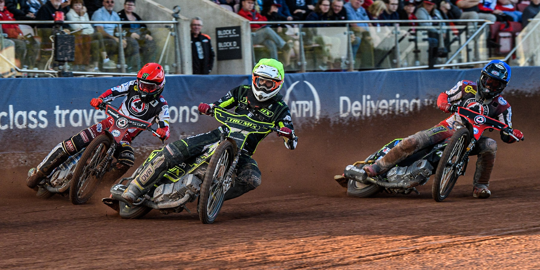 Dan Bewley (Red) outside Keynan Rew (Yellow) and Tom Brennan (Blue) during the Sports Insure Premiership match between Belle Vue Aces and Ipswich Witches at the National Speedway Stadium, Manchester on Monday 5th June 2023. (Photo: Ian Charles | MI News)