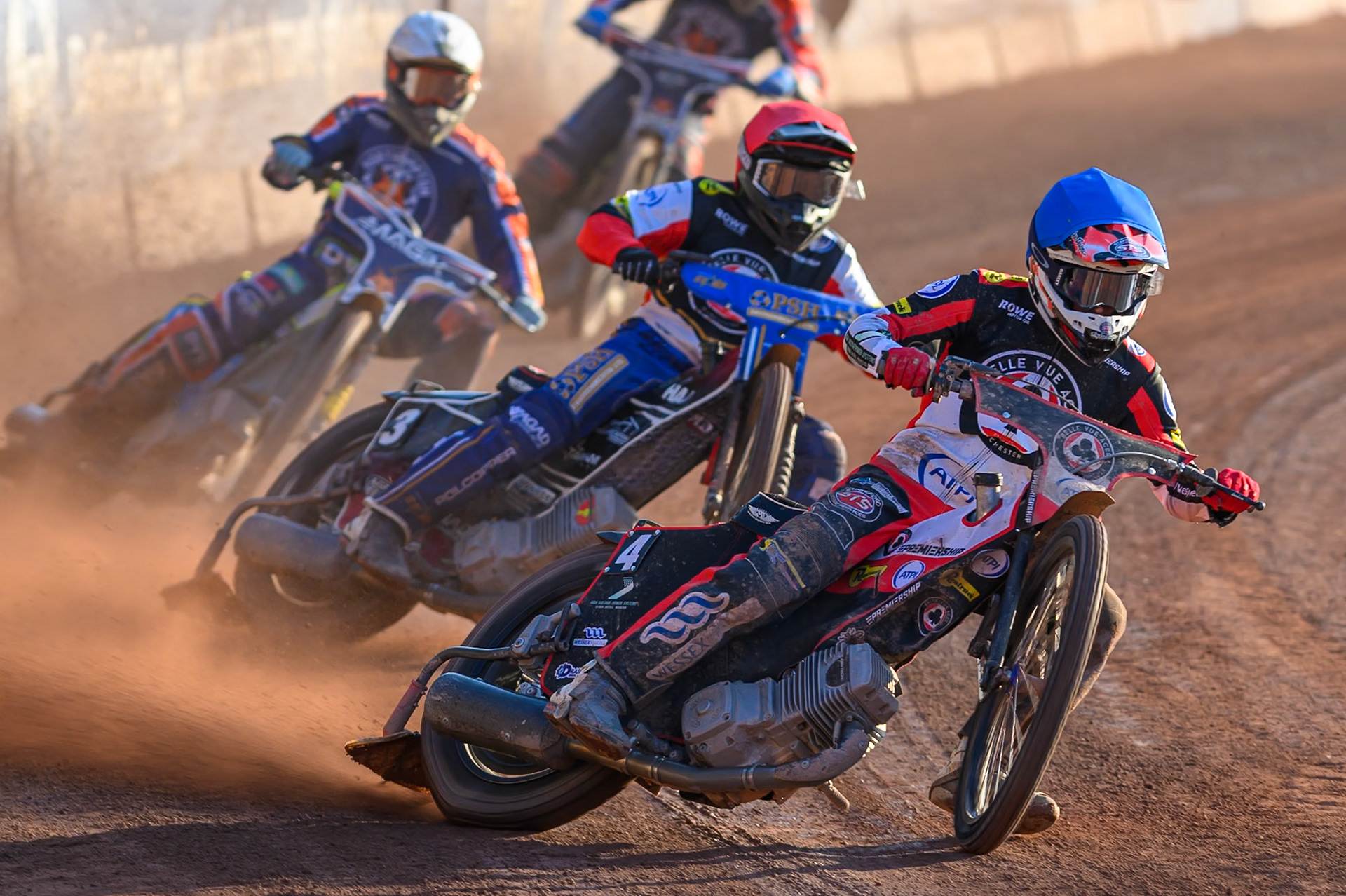 Zach Cook of Belle Vue Aces  in Blue leading Ben Cook, Guest Rider for Belle Vue Aces in Red andJaimon Lidsey of Northampton Foxes  in White during the Rowe Motor Oil Premiership match between Belle Vue Aces and Northampton Foxes at the National Speedway Stadium, Manchester on Monday 13th July 2026. (Photo: Ian Charles | MI News)