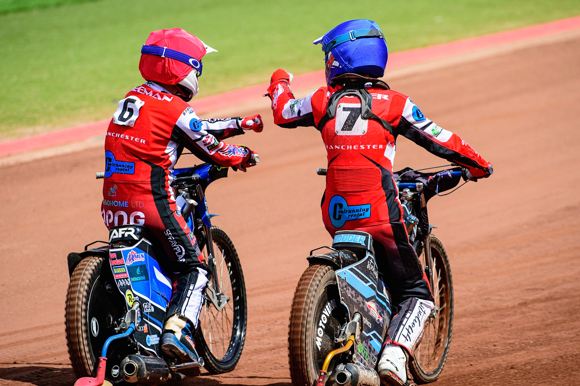 MANCHESTER, UK.  JUN 3RD  Archie Freeman  (Red) and Freddy Hodder  (Blue) celebrate their heat win during the National Development League match between Belle Vue Colts and Oxford Chargers at the National Speedway Stadium, Manchester on Friday 3rd June 2022. (Credit: Ian Charles | MI News)