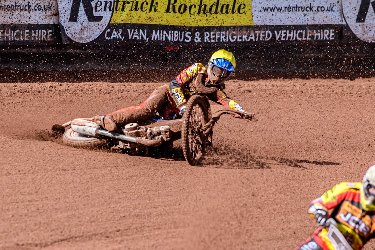 Leicester Lion Cubs' Sonny Springer  (Yellow) falls behind team mate Leicester Lion Cubs' Luke Crang (White) during the WSRA  National Development League match between Belle Vue Colts and Leicester Lion Cubs at the National Speedway Stadium, Manchester on Friday 29th March 2024. (Photo: Ian Charles | MI News)
