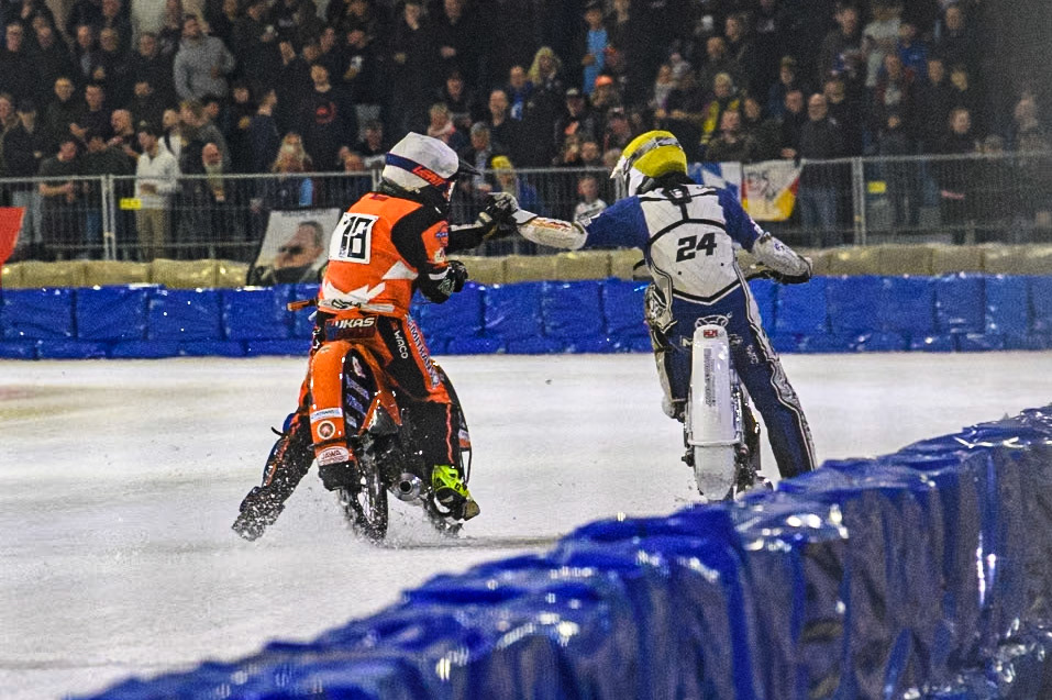 Reserve Czech Republic's Lukáš Hutla (18) congratulates Finland's Max Koivula (24) after their heat during the FIM Ice Speedway Gladiators World Championship Final 3 at Ice Rink Thialf, Heerenveen on Saturday 6th April 2024. (Photo: Ian Charles | MI News)