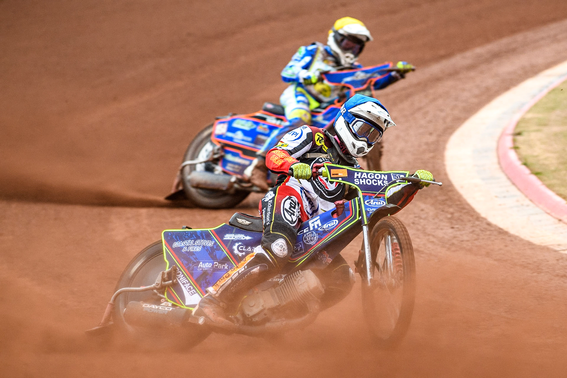 Belle Vue Aces' guest Jake Mulford  in Blue leading Oxford Spires' Luke Killeen  in Yellow during the Rowe Motor Oil Premiership match between Belle Vue Aces and Oxford Spires at the National Speedway Stadium, Manchester on Monday 22nd July 2024. (Photo: Ian Charles | MI News)