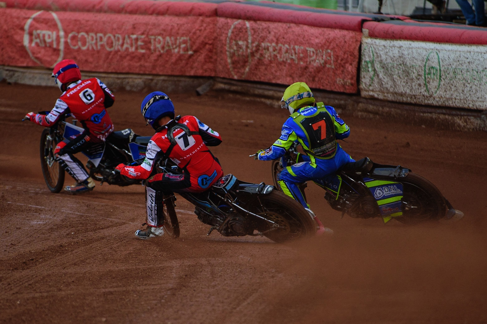 Freddy Hodder  (Blue) inside Luke Muff  (Yellow) with Archie Freeman  (Red) in front during the National Development League match between Belle Vue Colts and Mildenhall Fens Tigers at the National Speedway Stadium, Manchester on Friday 15th July 2022. (Credit: Ian Charles | MI News)