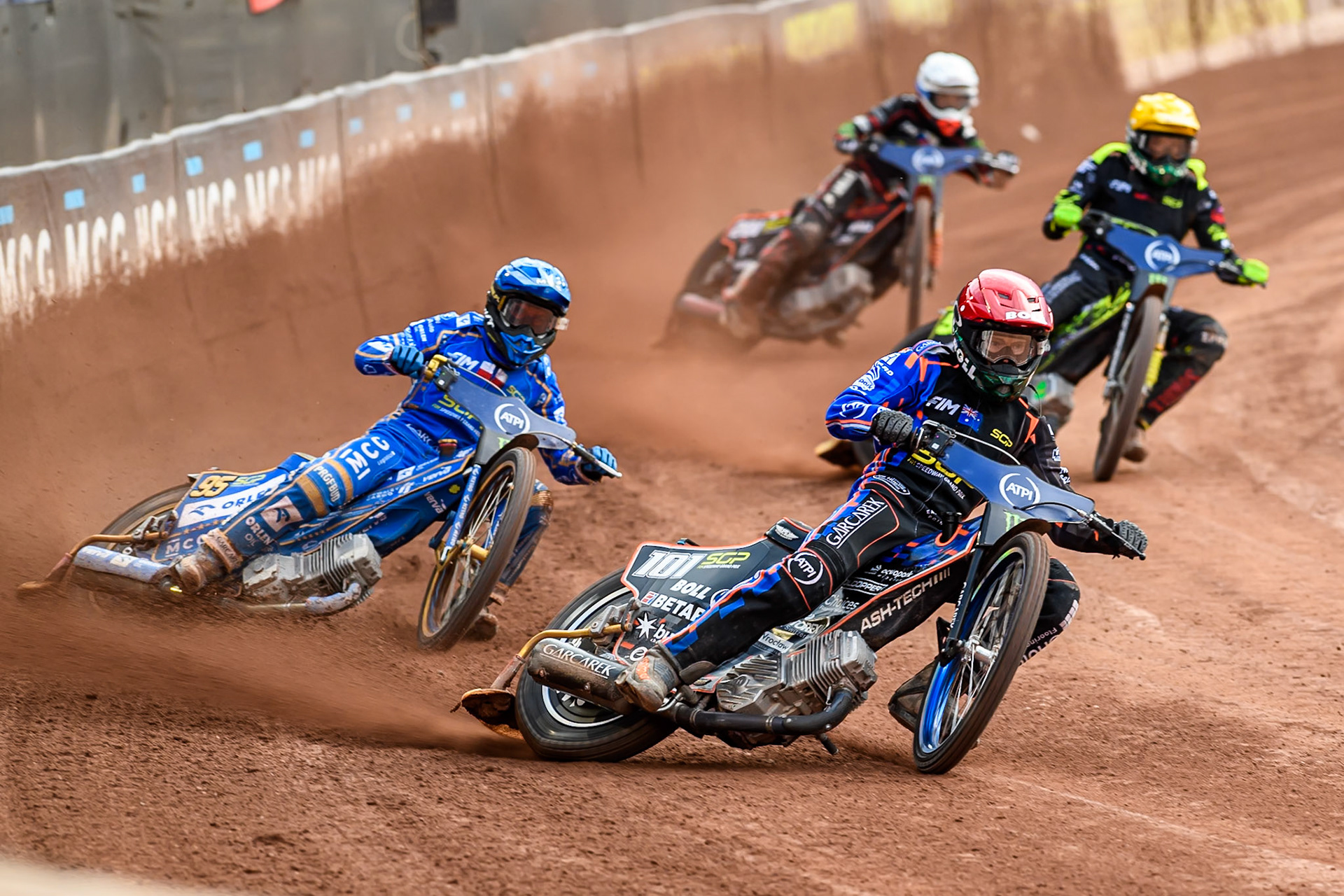 Brady Kurtz (101) of Australia in Red leading Bartosz Zmarzlik (95) of Poland in Blue Martin Vaculik (54) of Slovakia in Yellow and January Kvech (201) of Czech Republic in White during the ATPI FIM Speedway Grand Prix Round 4 at the National Speedway Stadium, Manchester, on Friday 13th June 2025. (Photo: Ian Charles | MI News)