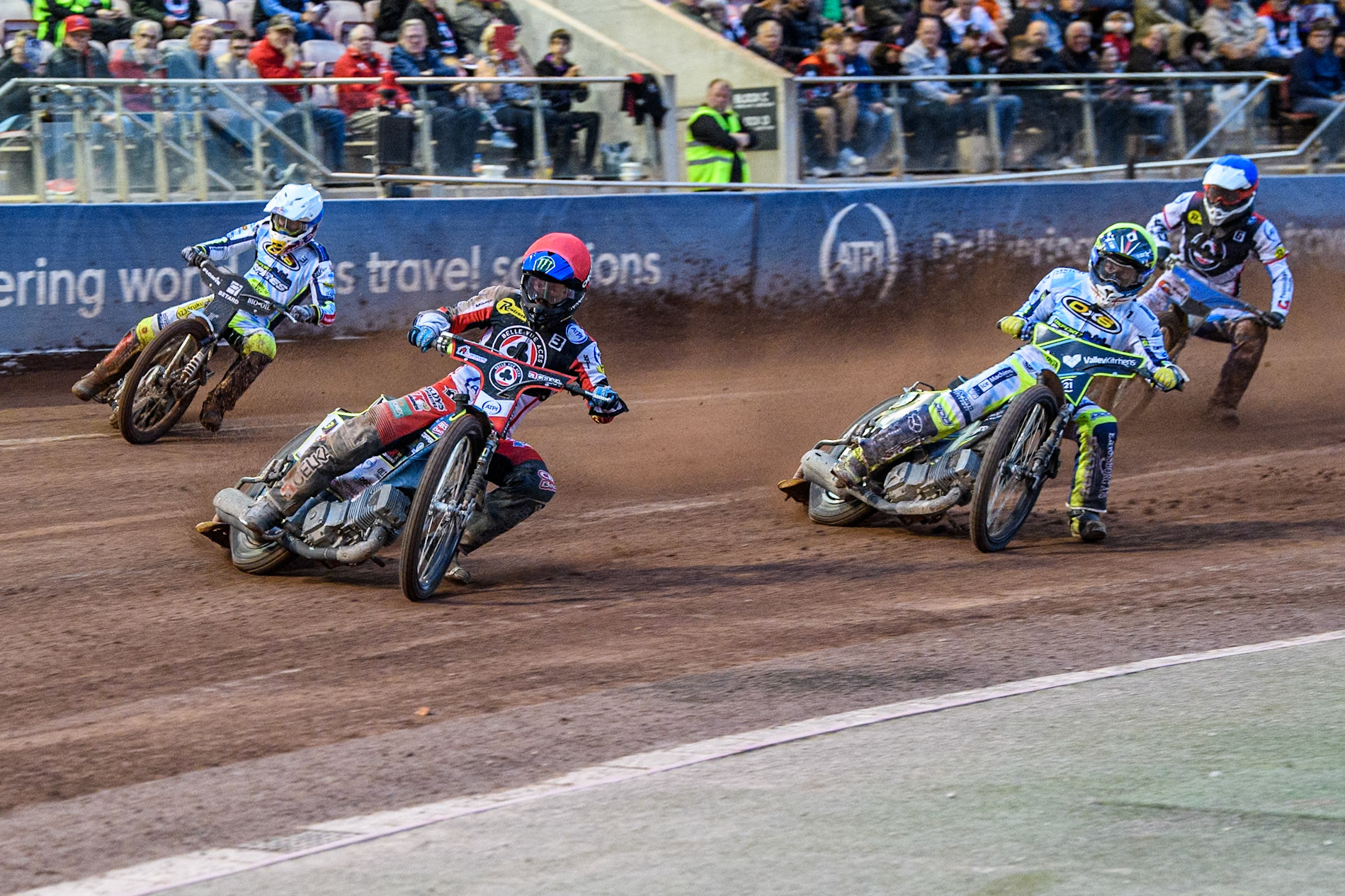 Belle Vue Aces' Jaimon Lidsey  in Red leading Oxford Spires' Rohan Tungate  in Yellow, Oxford Spires' Maciej Janowski  in White and Belle Vue Aces' guest Antti Vuolas  in Blue during the Rowe Motor Oil Premiership match between Belle Vue Aces and Oxford Spires at the National Speedway Stadium, Manchester on Monday 22nd July 2024. (Photo: Ian Charles | MI News)