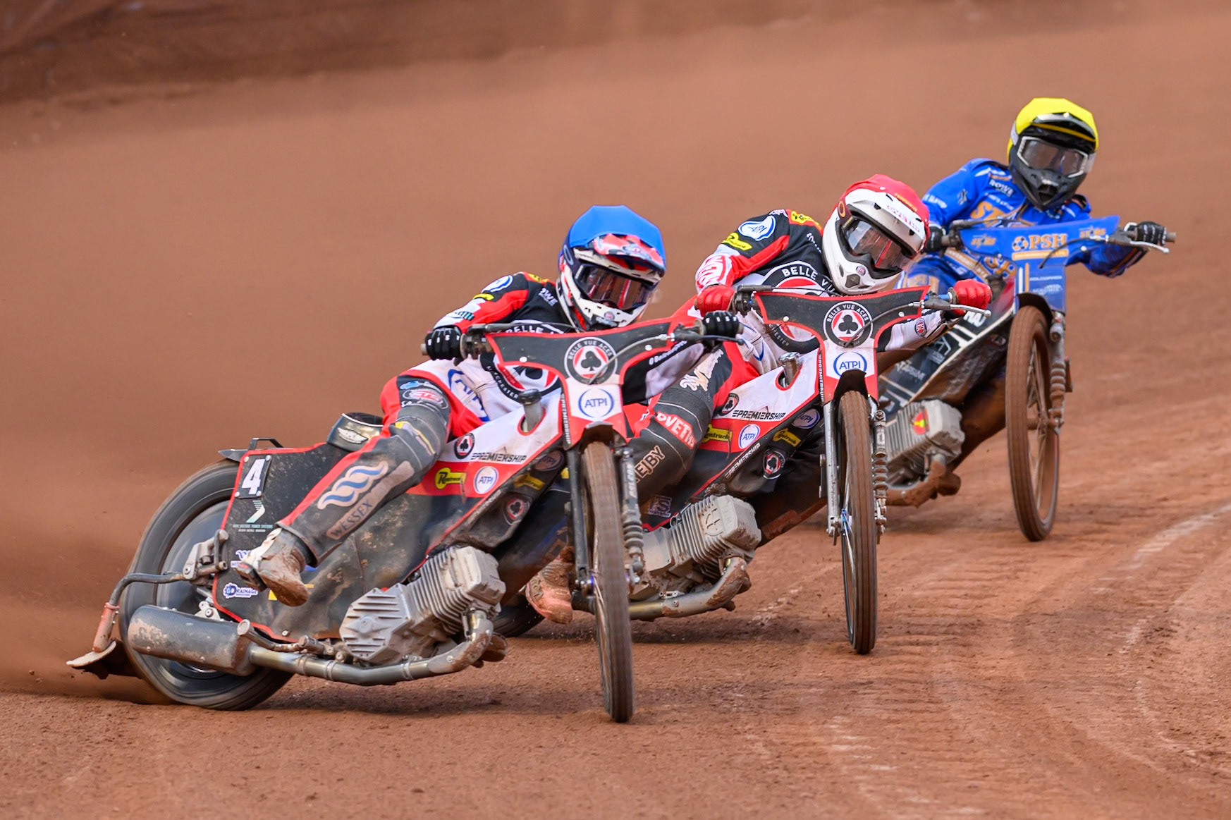 Zach Cook of Belle Vue Aces in Blue leading Peter Kildemand of Belle Vue Aces in Red and Ben Cook of Kings Lynn Stars in Yellow during the Rowe Motor Oil Premiership match between Belle Vue Aces and King's Lynn Stars at the National Speedway Stadium, Manchester on Monday 29th June 2026. (Photo: Ian Charles | MI News)