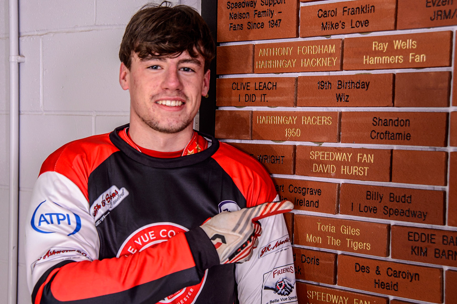 Billy Budd proudly points to the brick he bought on the Belle Vue Concourse during the Belle Vue Aces Media Day at the National Speedway Stadium, Manchester on Wednesday 12th March 2025. (Photo: Ian Charles | MI News)